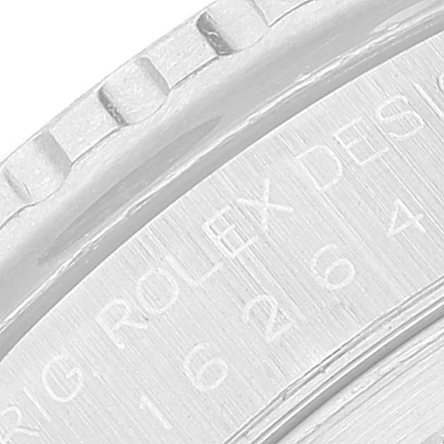 This image shows a close-up of the bezel and engraved text on the case back of a Rolex Turn-o-Graph 16264 Men
s Stainless Steel Blue Dial 16264 Men
s Stainless Steel Blue Dial watch.