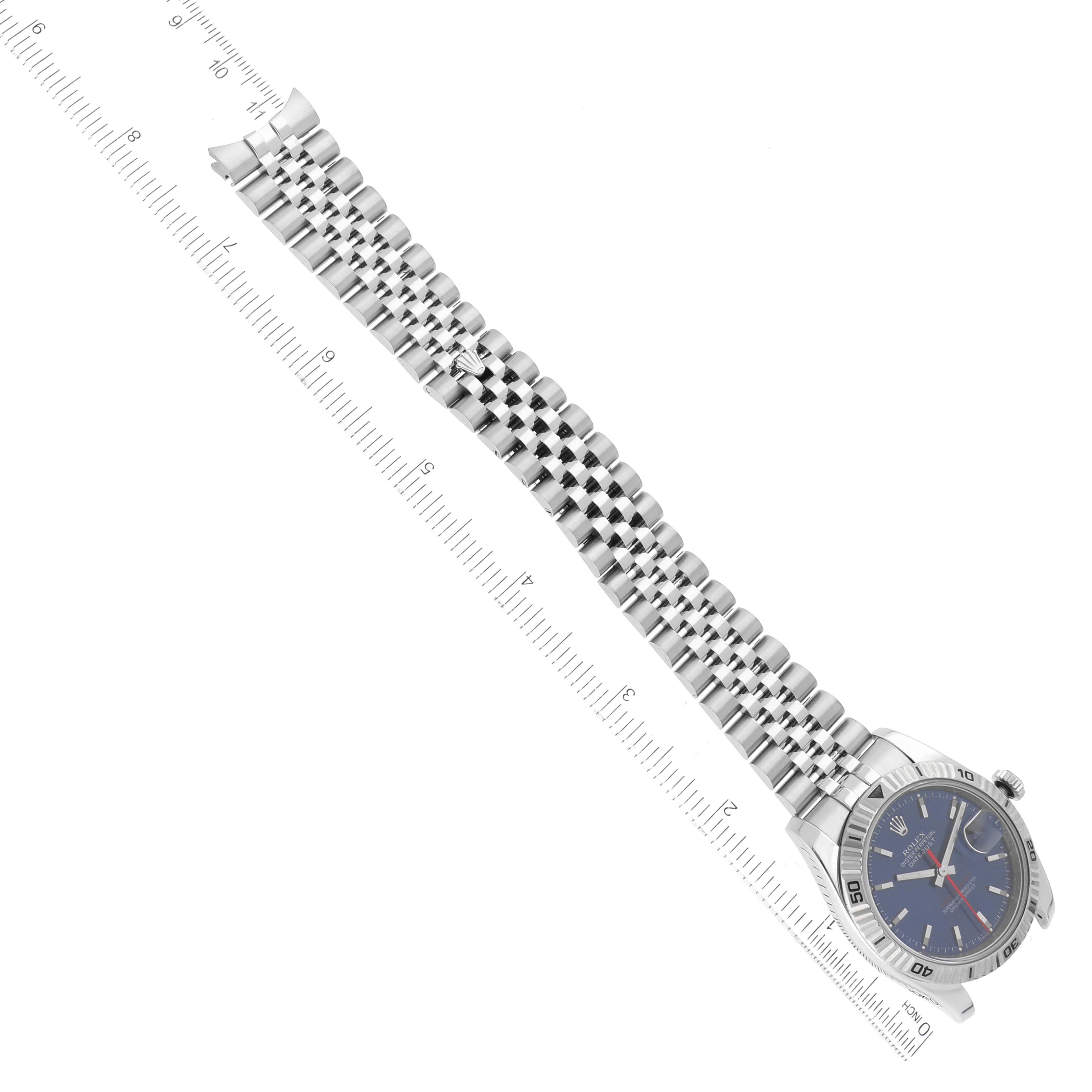 The image shows a Rolex Turn-o-Graph 116264 Men
s Stainless Steel Blue Dial 116264 Men
s Stainless Steel Blue Dial watch from a top-down angle, revealing its face, bezel, and full metal bracelet.