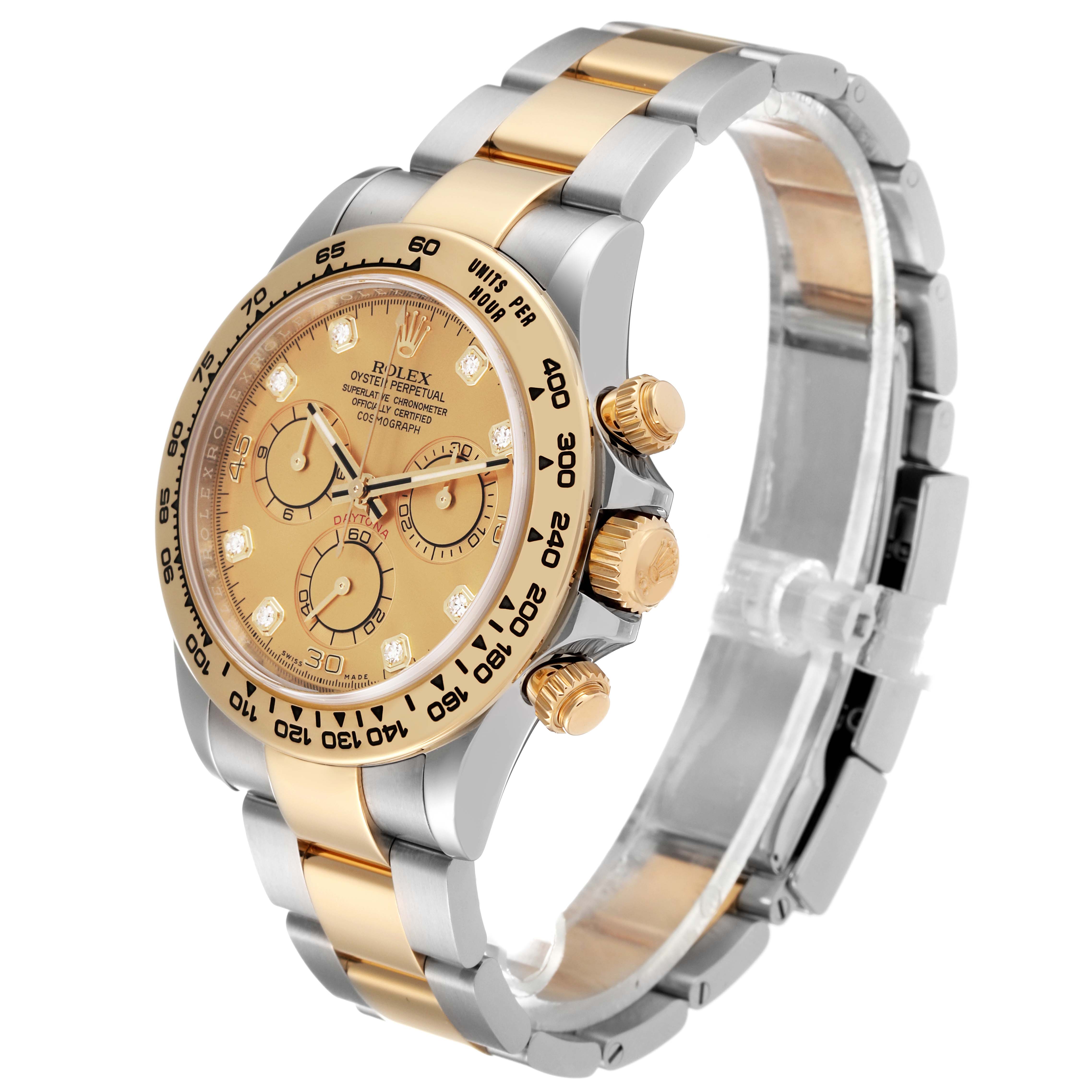 This image shows a side angle of a Rolex Daytona 116503 Men's Steel and Gold (two tone) Champagne Dial 116503 Men's Steel and Gold (two tone) Champagne Dial watch, highlighting its bezel, dial, pushers, and two-tone bracelet.