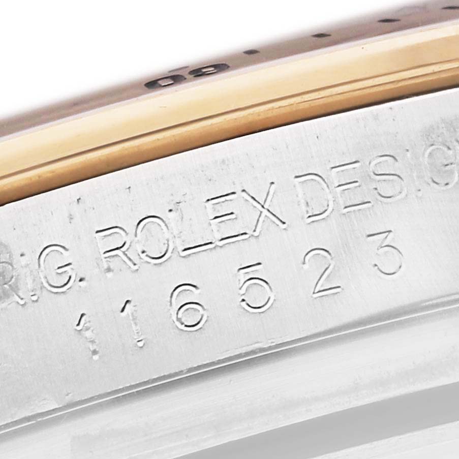 The image shows a close-up of the side engraving on a Rolex Daytona 116523 Men's Steel and Gold (two tone) Grey Dial 116523 Men's Steel and Gold (two tone) Grey Dial, displaying the model number.