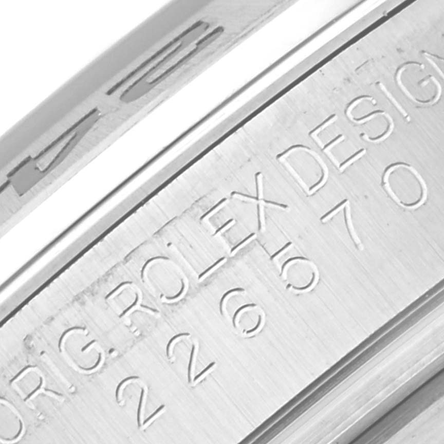 The image shows a close-up of the engraved inner bezel of a Rolex Explorer 226570 Men's Stainless Steel Black Dial 226570 Men's Stainless Steel Black Dial watch.