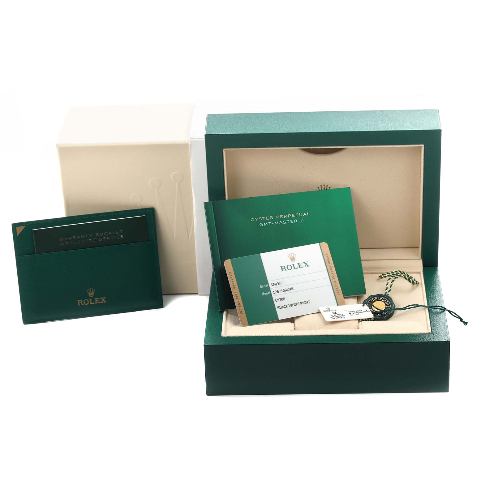 The image shows Rolex GMT-Master 126710BLNR Men's Stainless Steel Black Dial 126710BLNR Men's Stainless Steel Black Dial packaging, including a green box, warranty booklet, and cards.