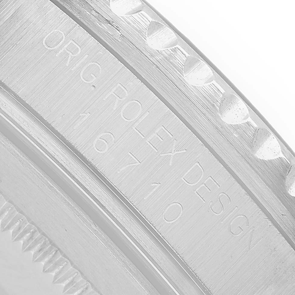 The image shows a close-up of the case edge with "ORIG. ROLEX DESIGN 16710" engraved on the Rolex GMT-Master 16710 Men's Stainless Steel Black Dial watch.