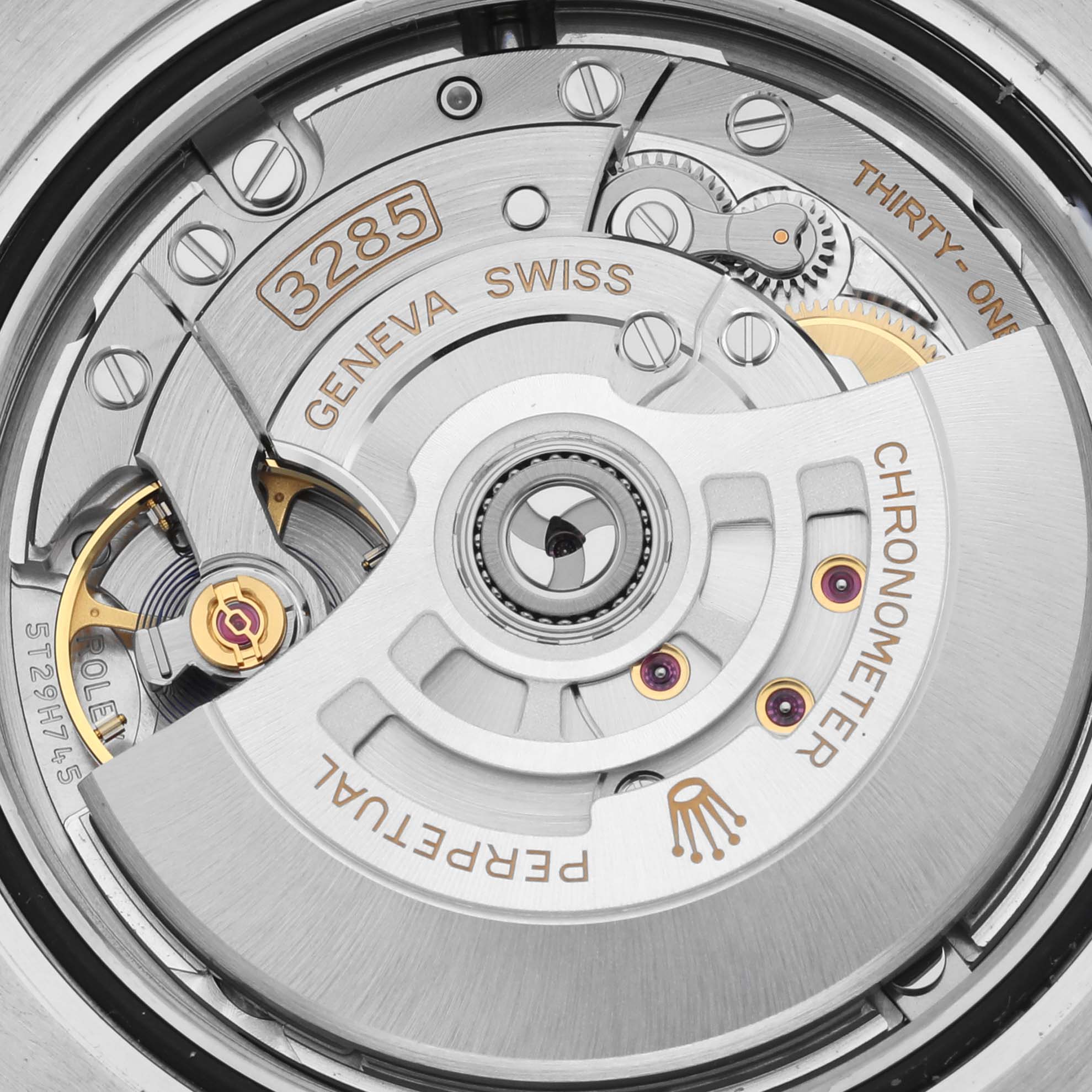 The image shows a close-up of the movement inside a Rolex GMT-Master 126711CHNR Men's Steel and Gold (two tone) Black Dial 126711CHNR Men's Steel and Gold (two tone) Black Dial watch, highlighting the rotor and inner mechanics.
