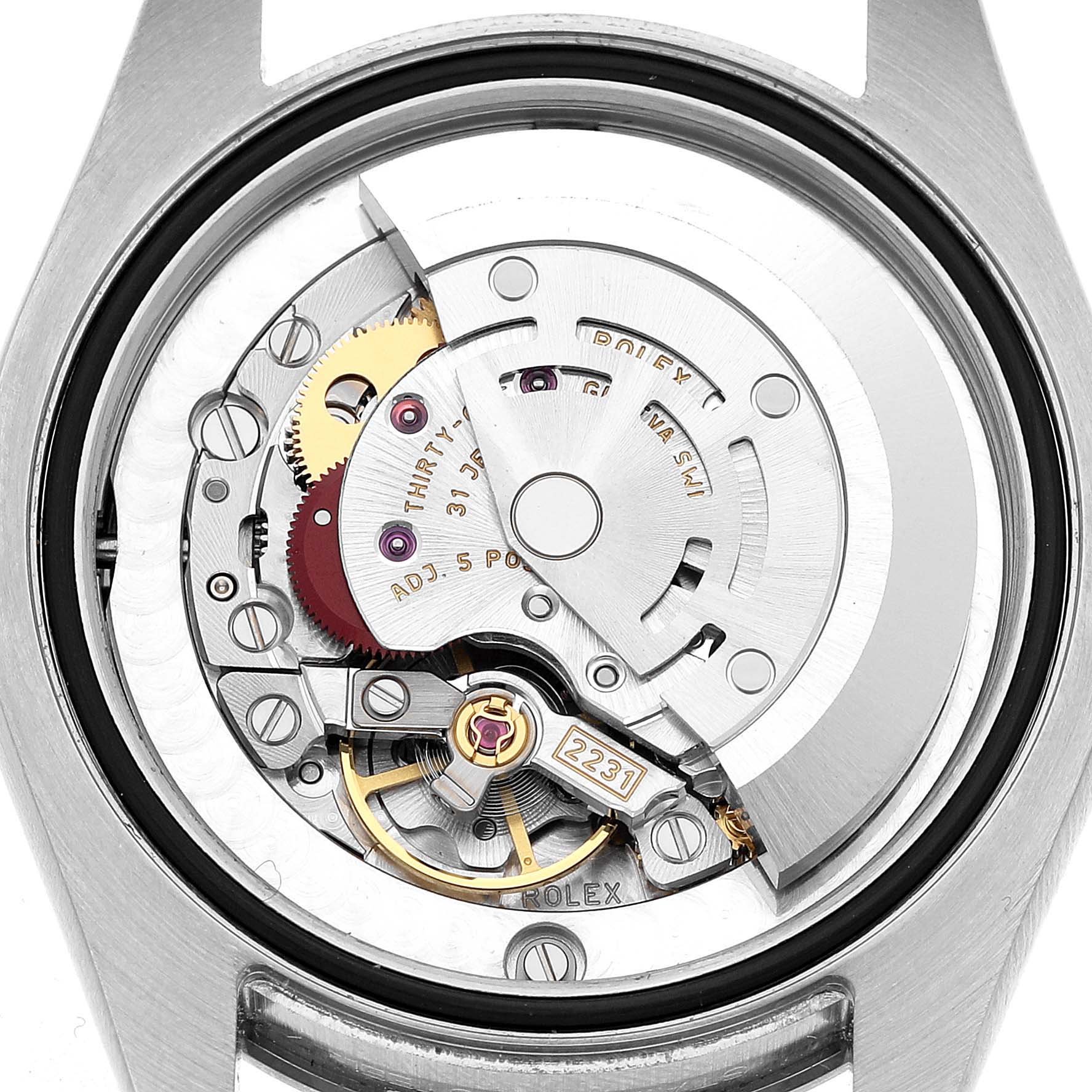 The image shows the back view of a Rolex Mid-Size 177200 Women's Stainless Steel White Dial model, displaying its intricate movement and internal mechanisms.