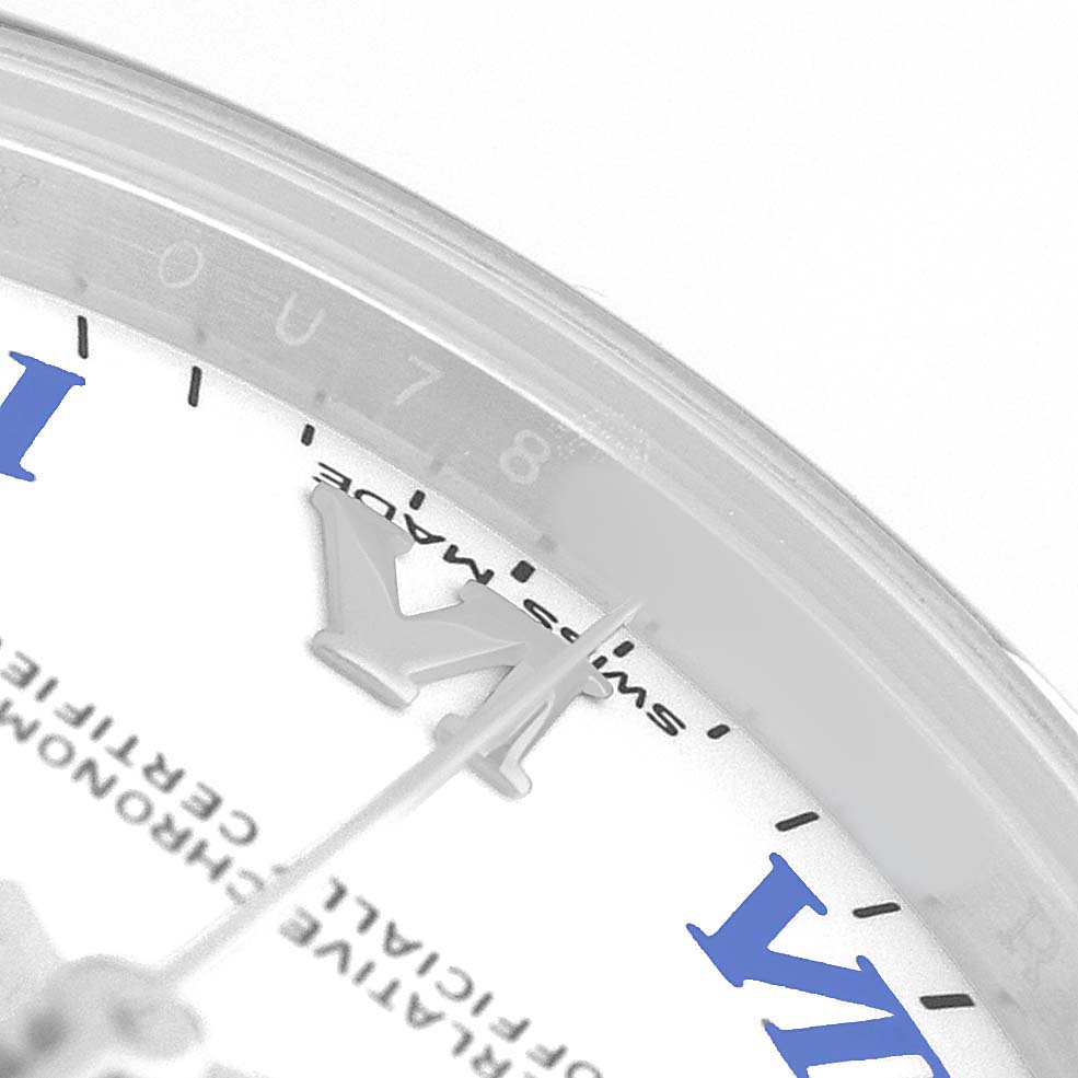 The image shows a close-up of the dial and edge of a Rolex Mid-Size 177200 Women's Stainless Steel White Dial watch, revealing Roman numerals and part of the minute track.