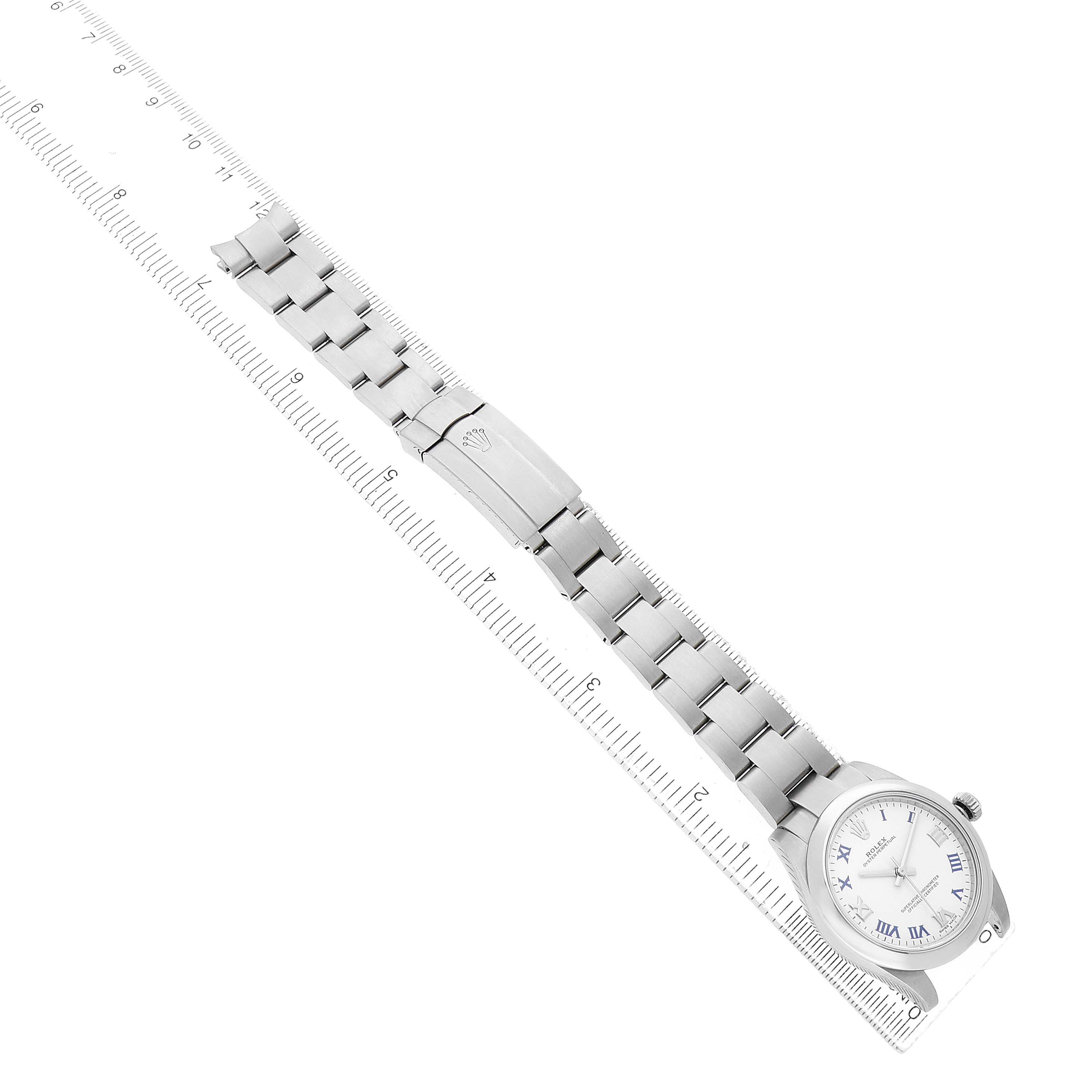 The Rolex Mid-Size 177200 Women's Stainless Steel White Dial watch is shown from a top-down angle, displaying the bracelet, clasp, and watch face.
