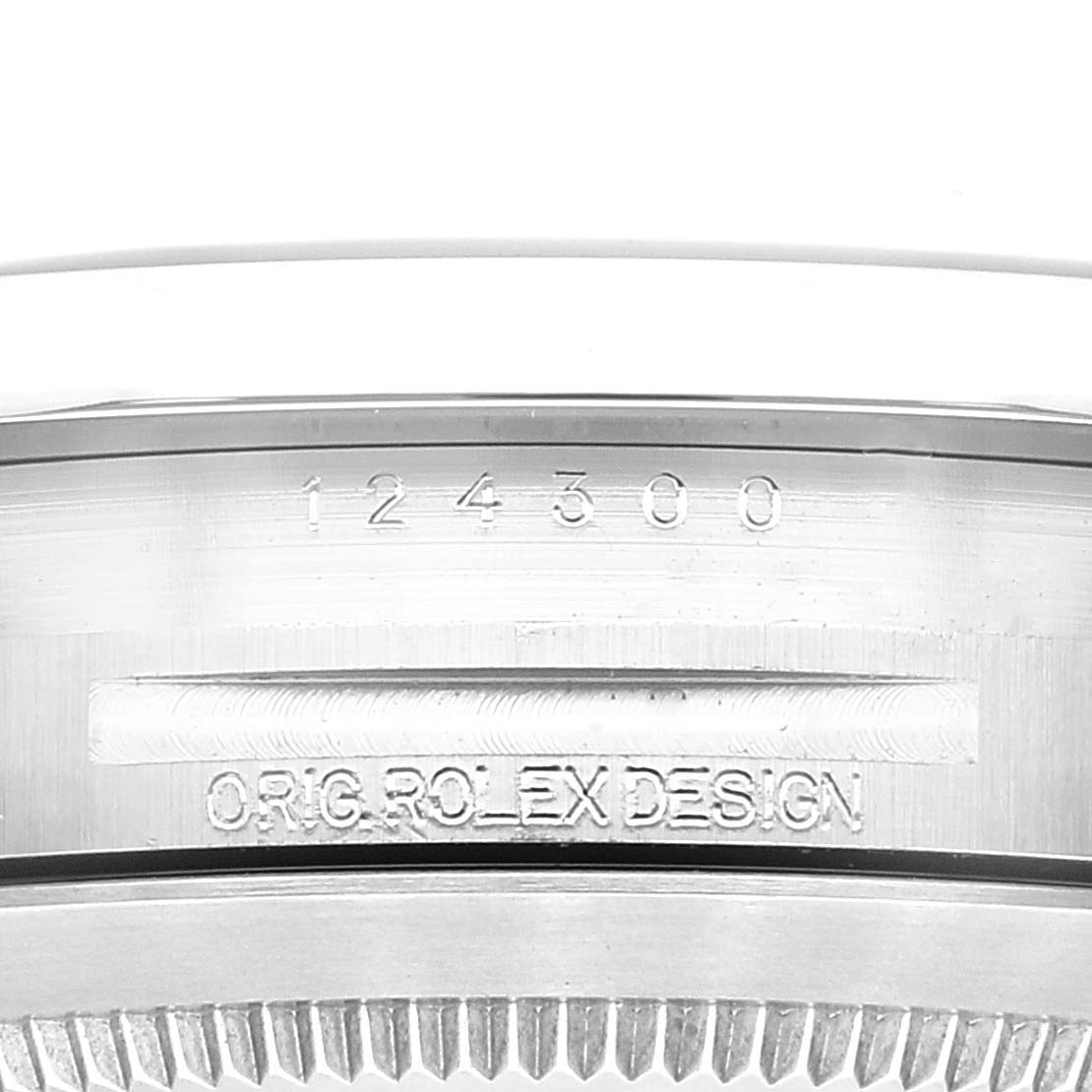 The image shows a close-up angle of the case back
s engraved model number and design details of a Rolex Oyster Perpetual 124300 Men
s Stainless Steel Black Dial 124300 Men
s Stainless Steel Black Dial watch.