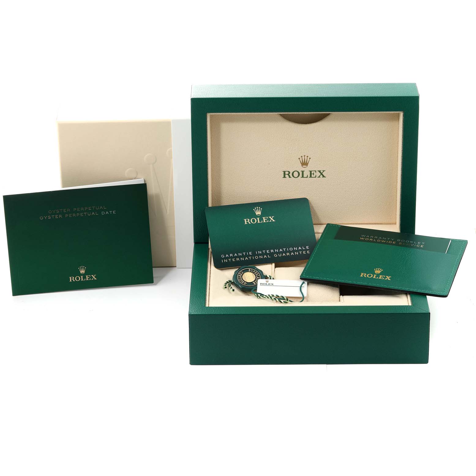 The image shows an open Oyster Perpetual Rolex watch box with accompanying booklets and accessories displayed.