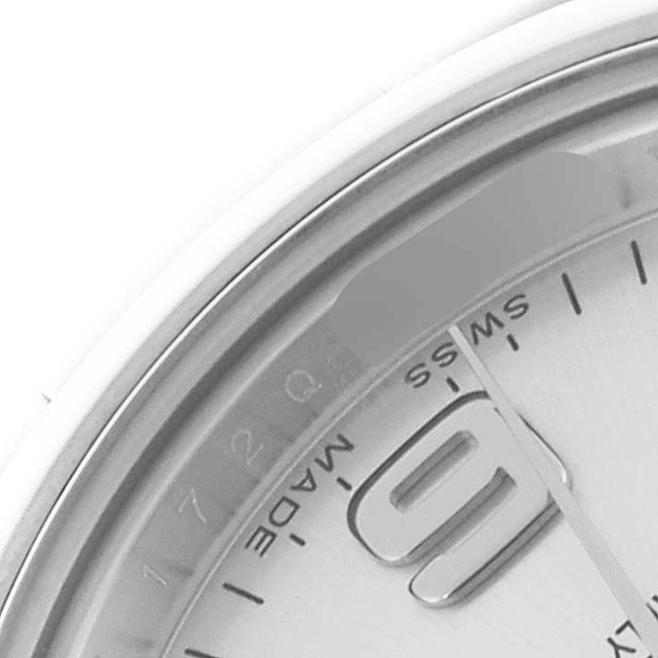 The image shows a close-up of the dial and bezel of a Rolex Oyster Perpetual 176200 Women's Stainless Steel Silver Dial 176200 Women's Stainless Steel Silver Dial watch, highlighting the "9" marker and part of the text.