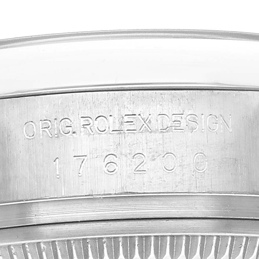 The image shows the side engraving of the case of a Rolex Oyster Perpetual 176200 Women's Stainless Steel Blue Dial 176200 Women's Stainless Steel Blue Dial watch, highlighting the model number.