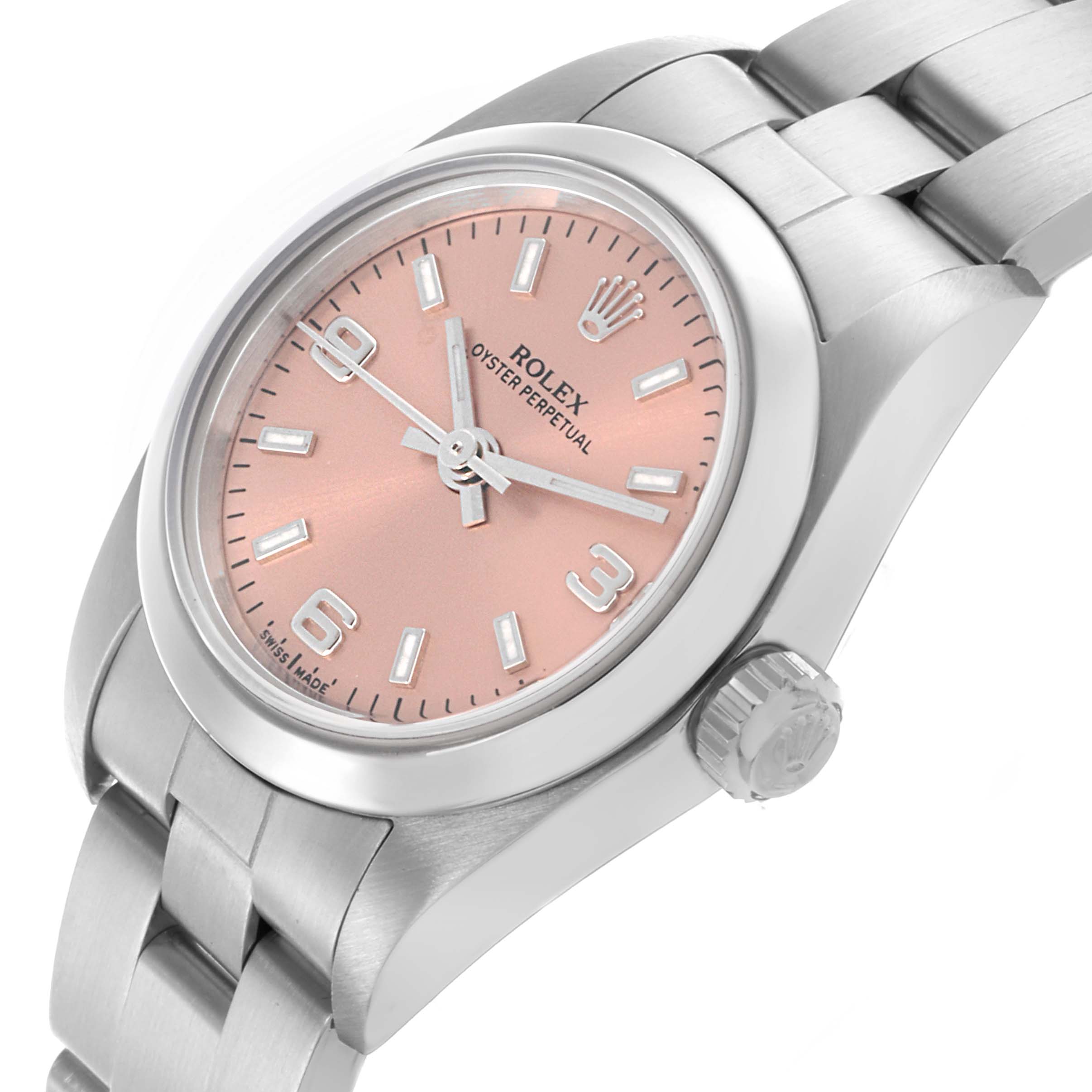 The Rolex Oyster Perpetual 76080 Women's Stainless Steel Pink Dial 76080 Women's Stainless Steel Pink Dial watch is shown at an angled view displaying its face, case, bezel, crown, and part of the bracelet.