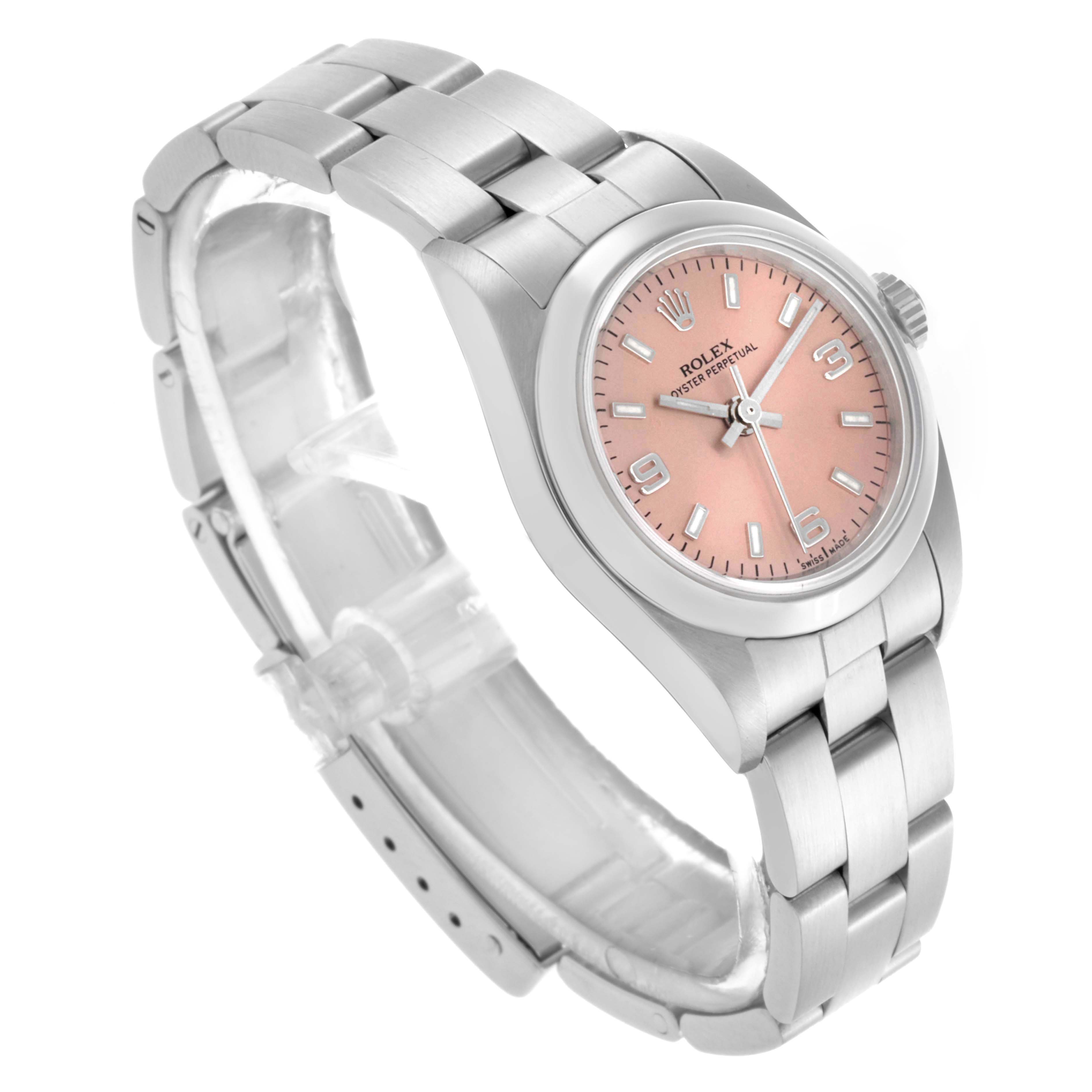 The Rolex Oyster Perpetual 76080 Women's Stainless Steel Pink Dial 76080 Women's Stainless Steel Pink Dial watch is shown at an angle highlighting the bracelet, case, and pink dial.