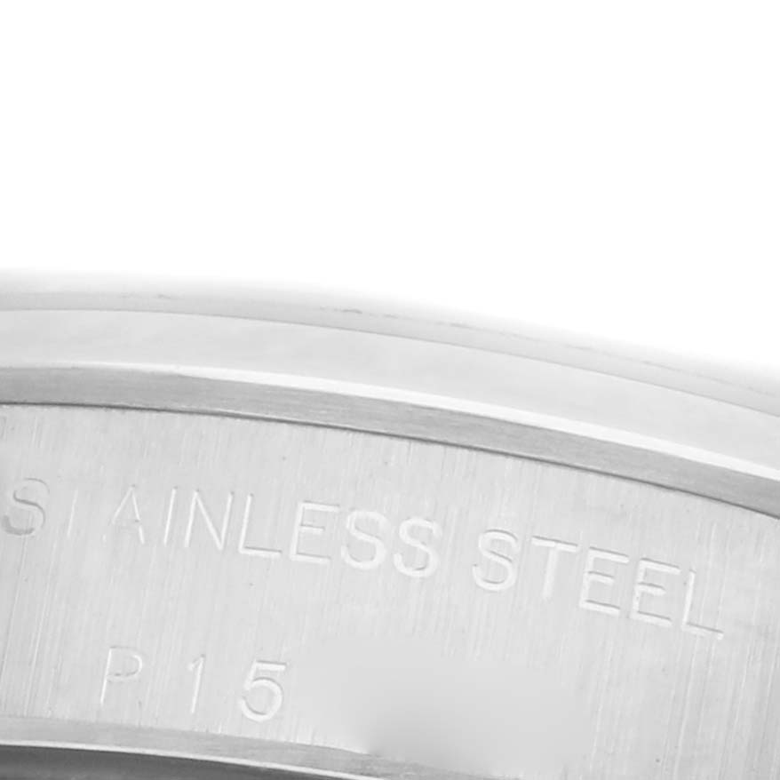 The image shows a close-up of the side of a Rolex Oyster Perpetual 76080 Women's Stainless Steel Pink Dial 76080 Women's Stainless Steel Pink Dial, focusing on the stainless steel engraving.