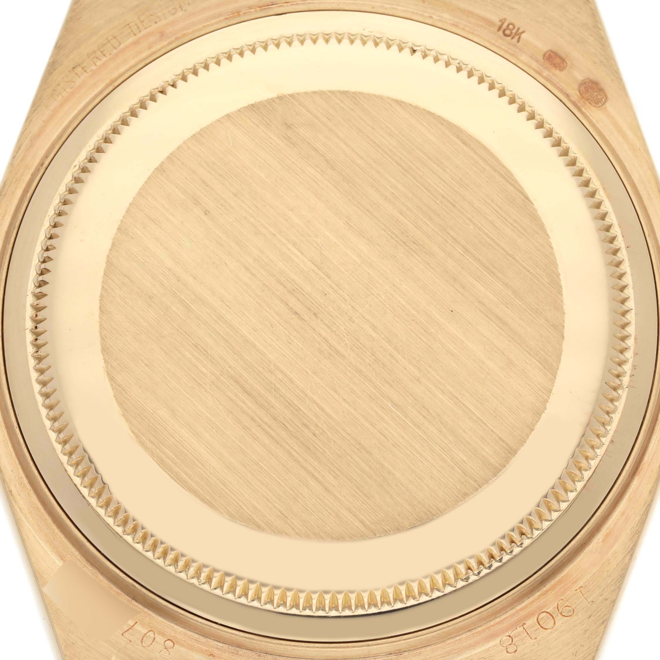 The image shows the case back of a Rolex Oysterquartz watch from a top-down angle.