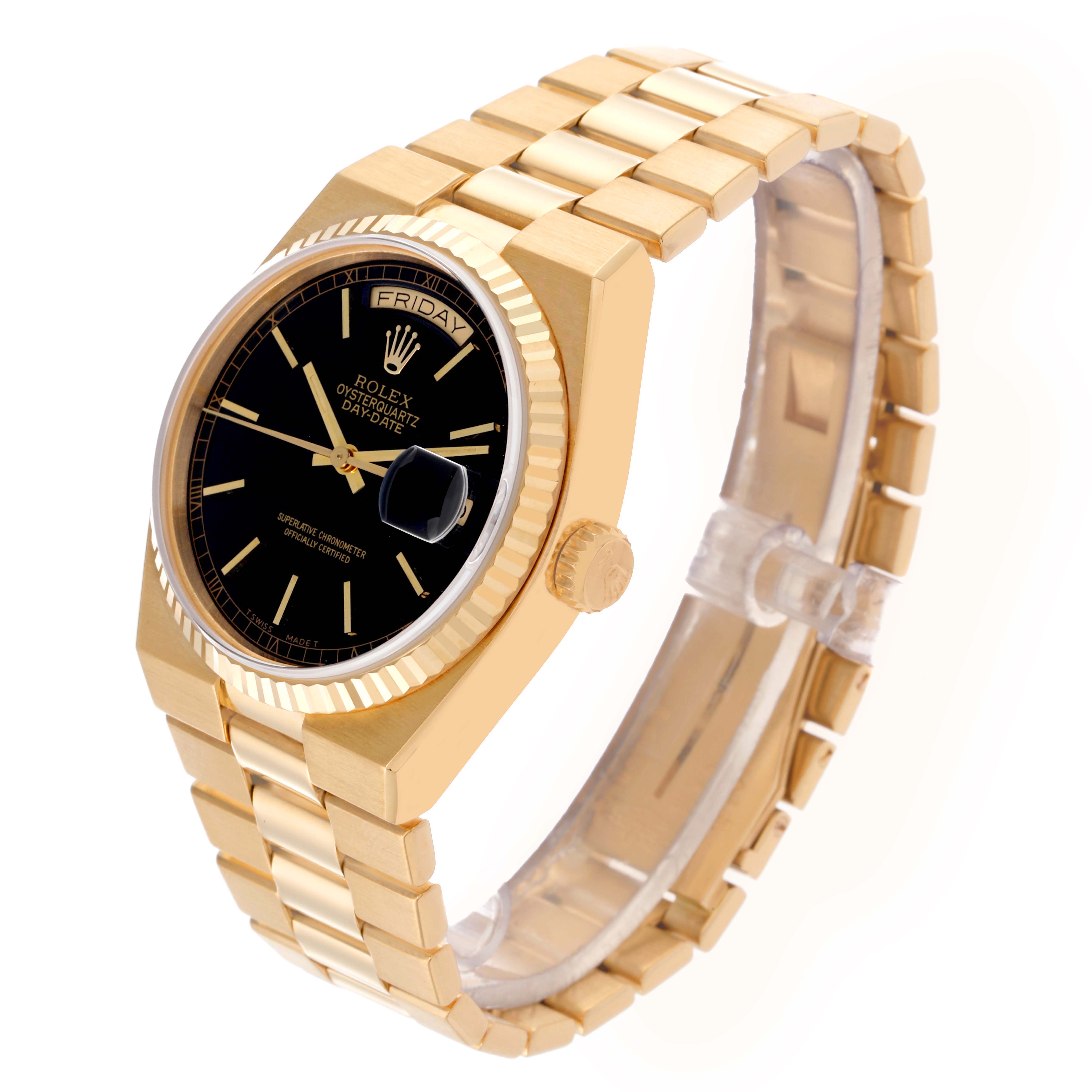 The Rolex Oysterquartz watch is shown at an angled side view, highlighting the black dial, fluted bezel, gold bracelet, and crown.