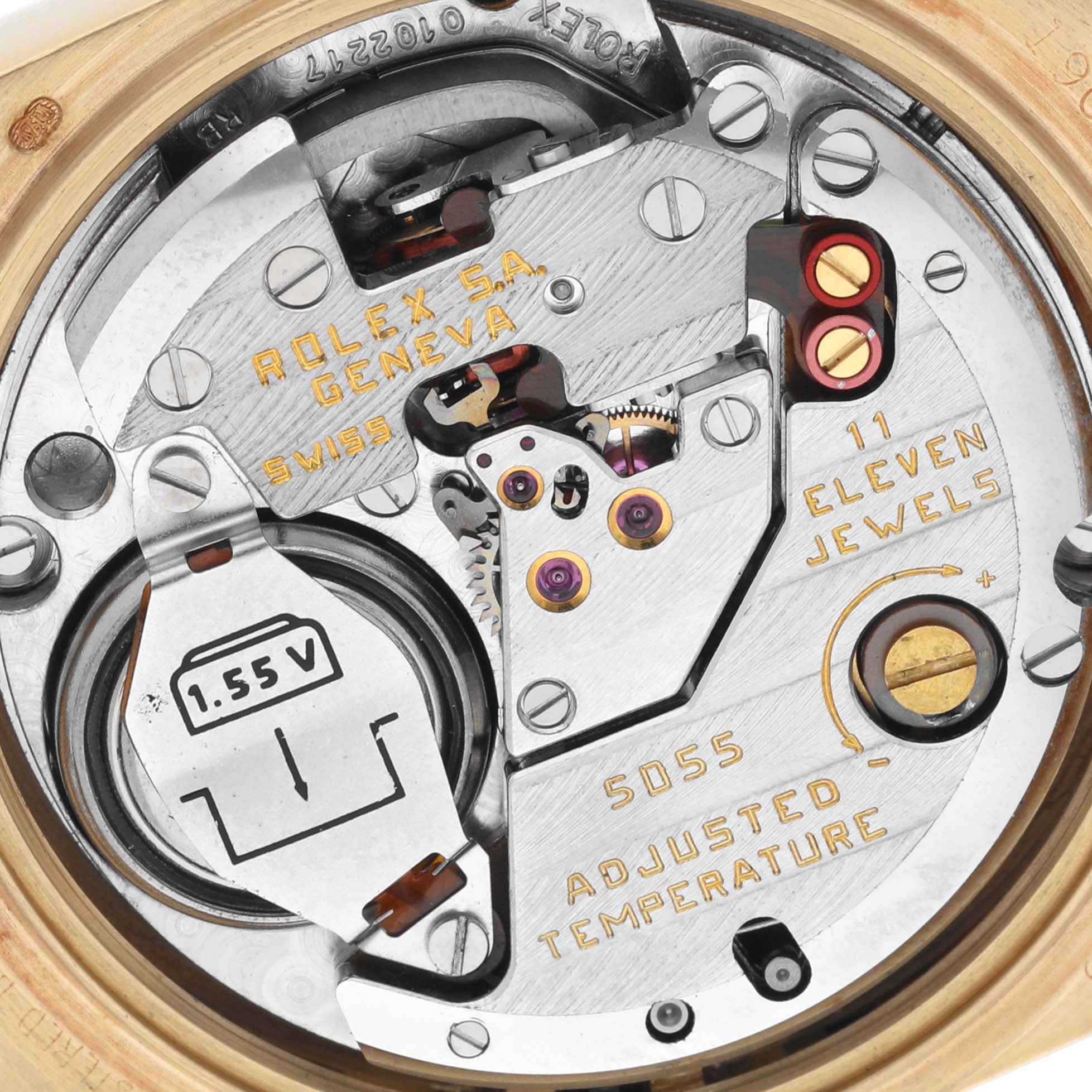 The image shows a detailed, close-up view of the Rolex Oysterquartz movement, highlighting the battery and mechanical components.