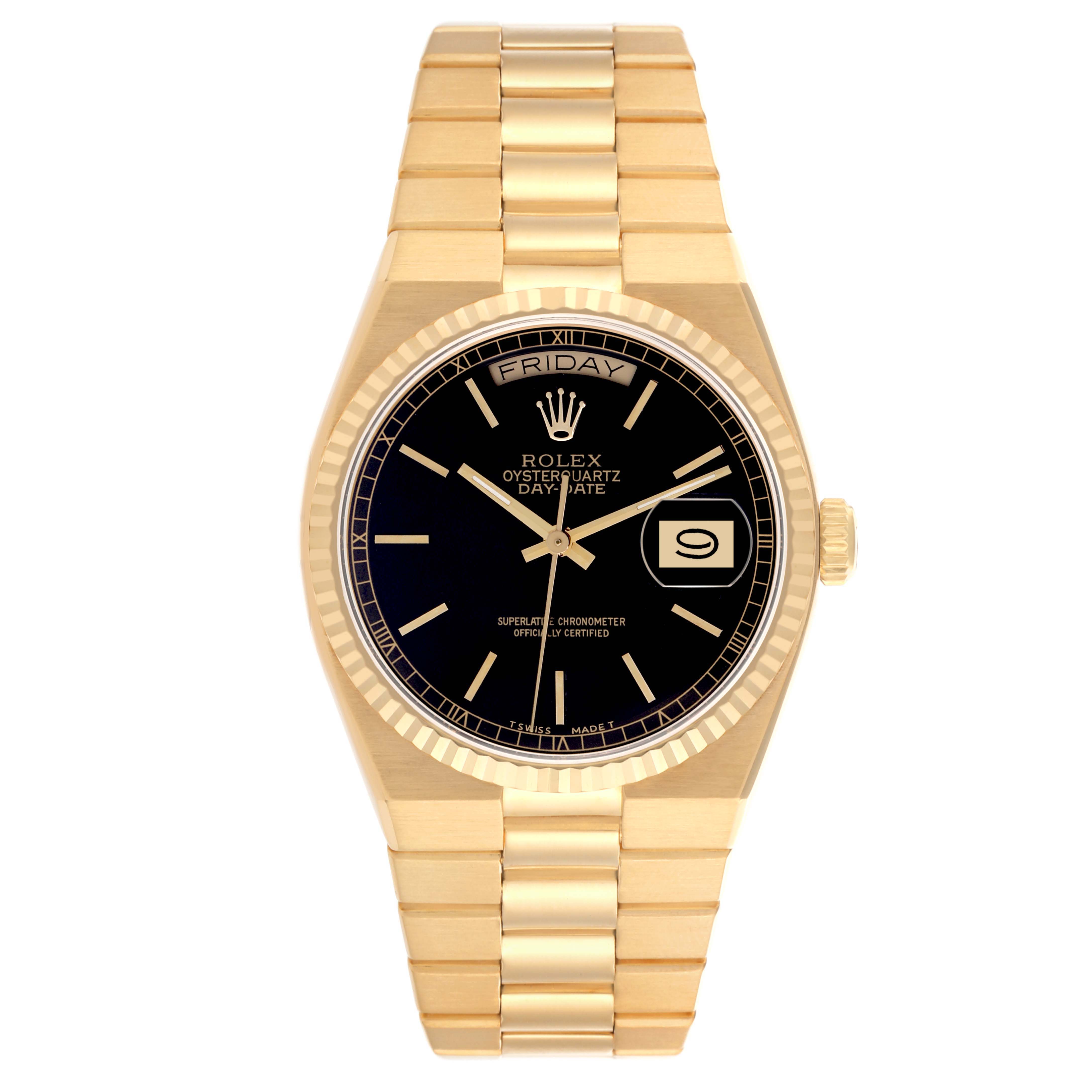 The Rolex Oysterquartz watch is shown from a top view, highlighting the black dial, gold bezel, day-date display, and bracelet.
