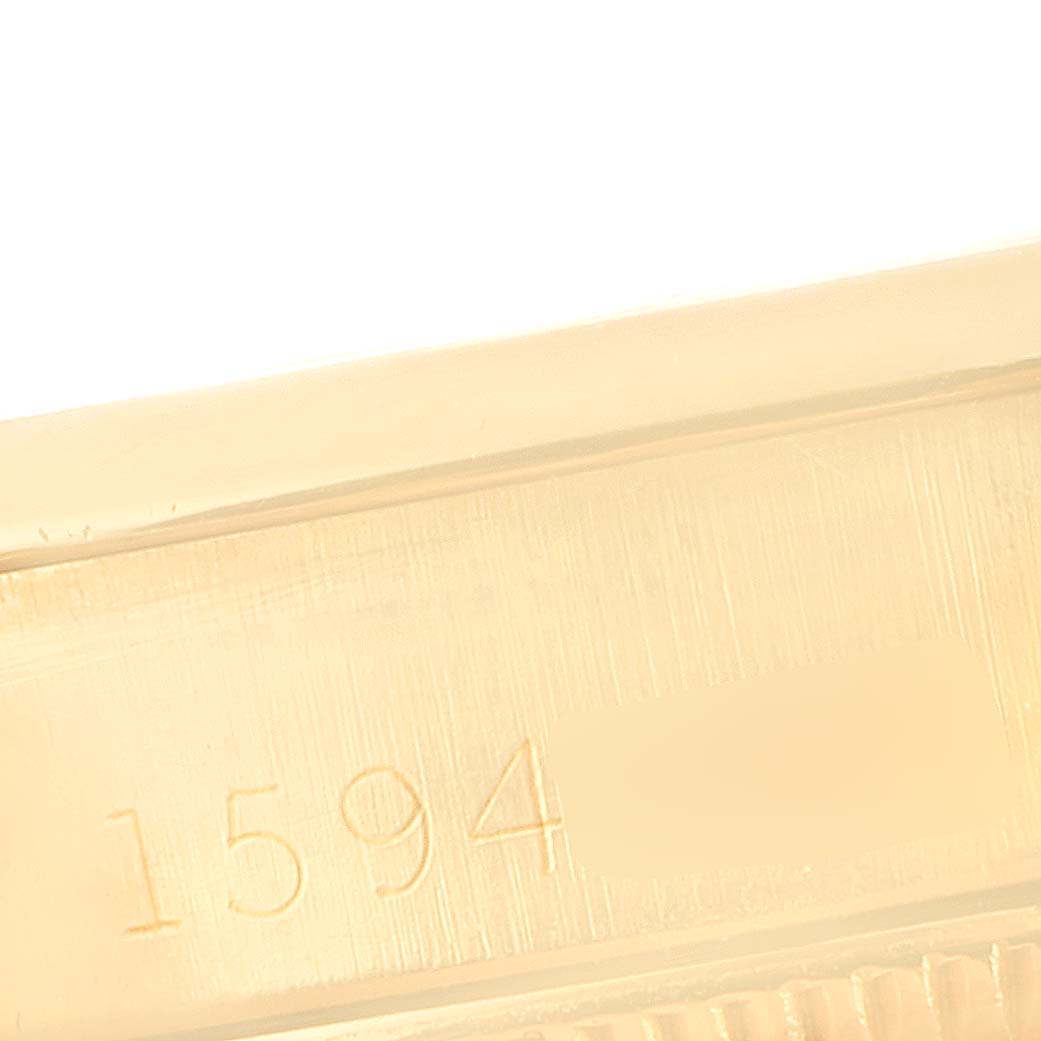 The image shows a close-up of the serial number on the case of a Rolex President 6517 Women's Yellow Gold Silver Dial 6517 Women's Yellow Gold Silver Dial model watch.