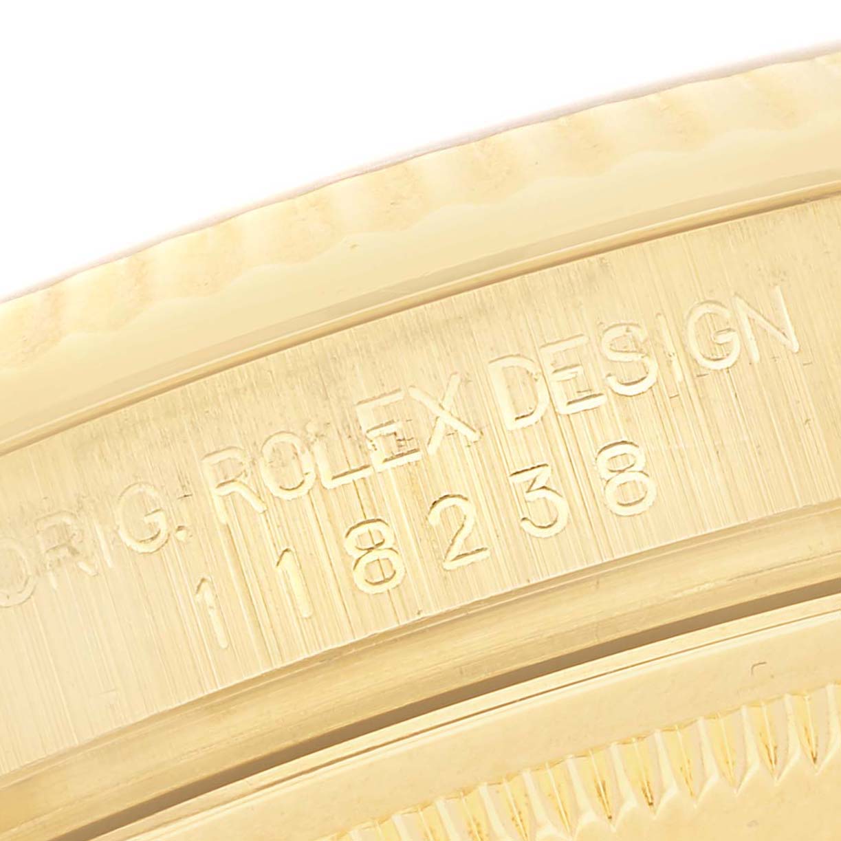 The image shows a close-up of the engraving on the inner bezel of a Rolex President 118238 Men's Yellow Gold Mother of Pearl Dial 118238 Men's Yellow Gold Mother of Pearl Dial watch, displaying its model number.