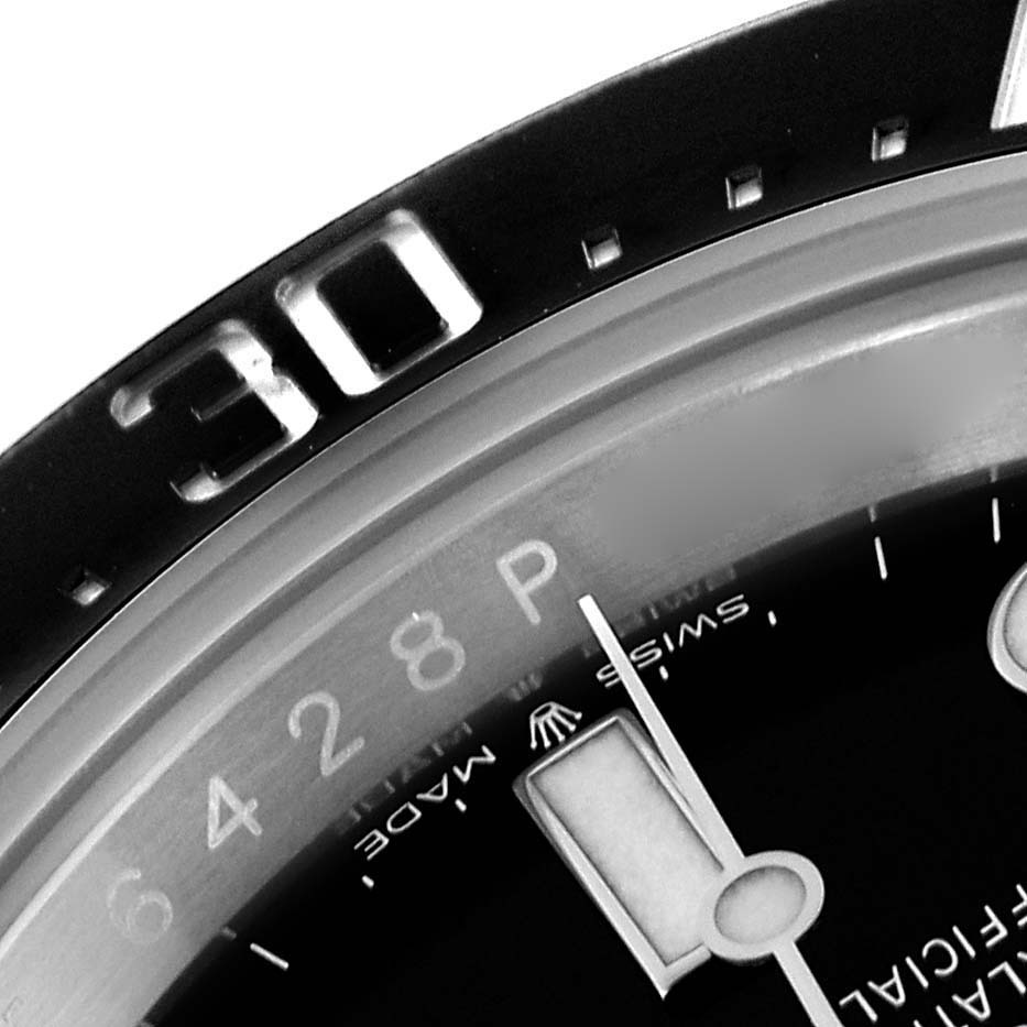 The image shows a close-up of the bezel and part of the dial of a Rolex Sea-Dweller 126600 Men's Stainless Steel Black Dial 126600 Men's Stainless Steel Black Dial, highlighting the 30-minute marker and hands.