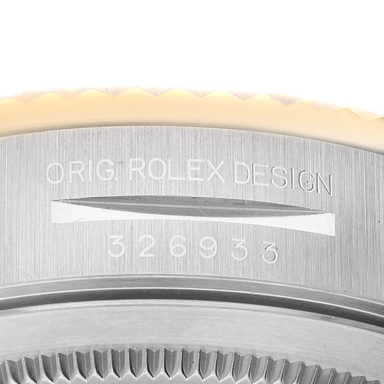 The image shows a close-up of the case back and serial number engraving of a Rolex Sky-Dweller 326933 Men's Steel and Gold (two tone) Black Dial 326933 Men's Steel and Gold (two tone) Black Dial watch.