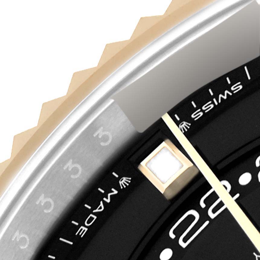 The image shows a close-up of the bezel, edge, and part of the face of the Rolex Sky-Dweller 336933 Men's Steel and Gold (two tone) Black Dial watch.