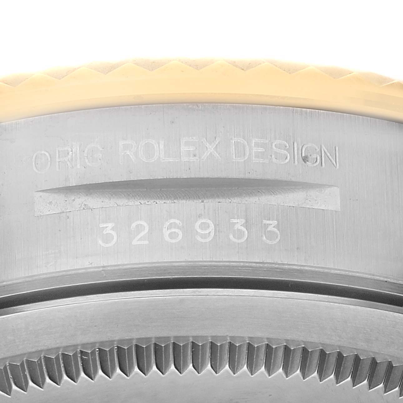 This is a close-up of the outer edge and serial number of a Rolex Sky-Dweller 326933 Men's Steel and Gold (two tone) Champagne Dial 326933 Men's Steel and Gold (two tone) Champagne Dial watch.