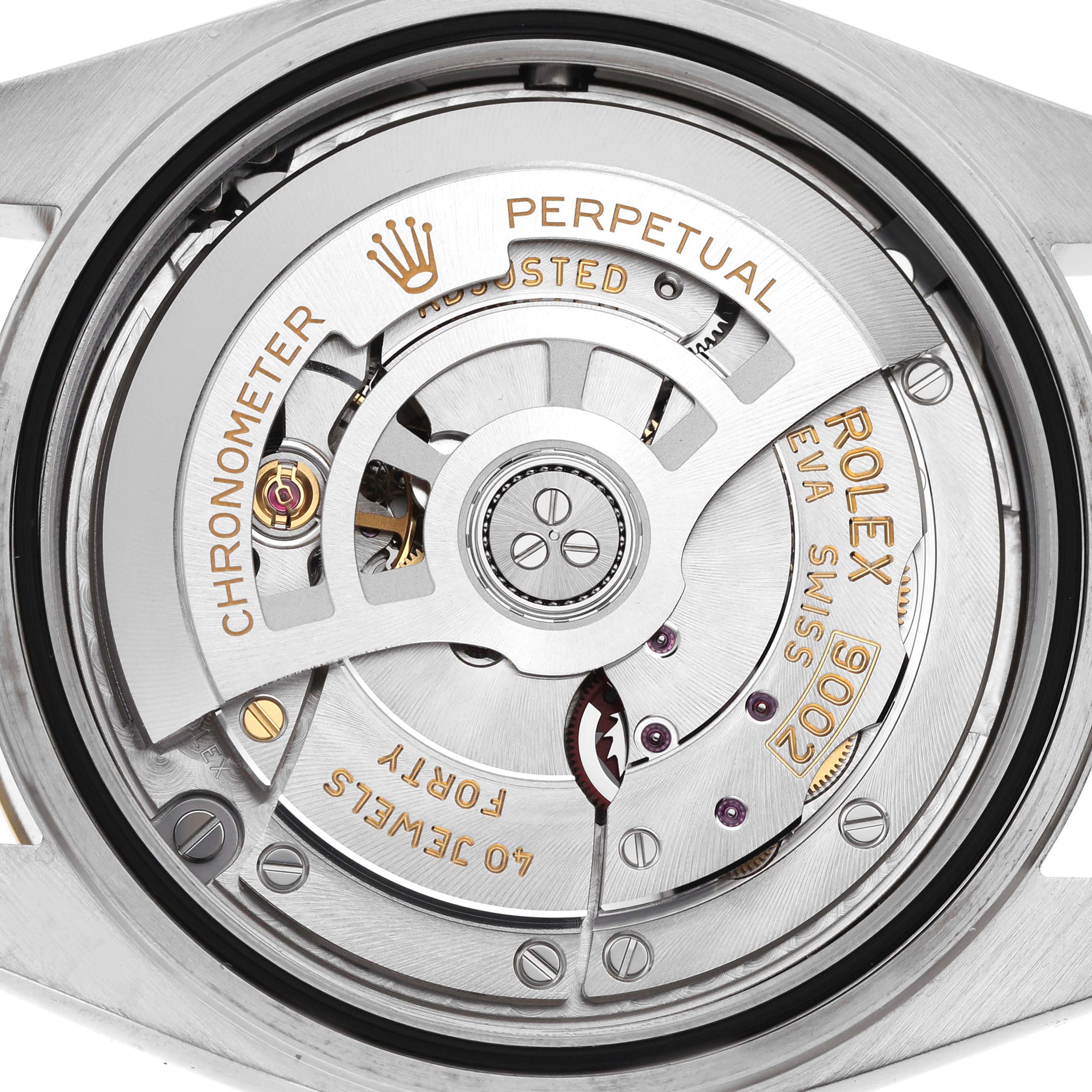 The image shows the movement of a Rolex Sky-Dweller 336933 Men's Steel and Gold (two tone) Silver Dial watch, highlighting the rotor and intricate internal components.