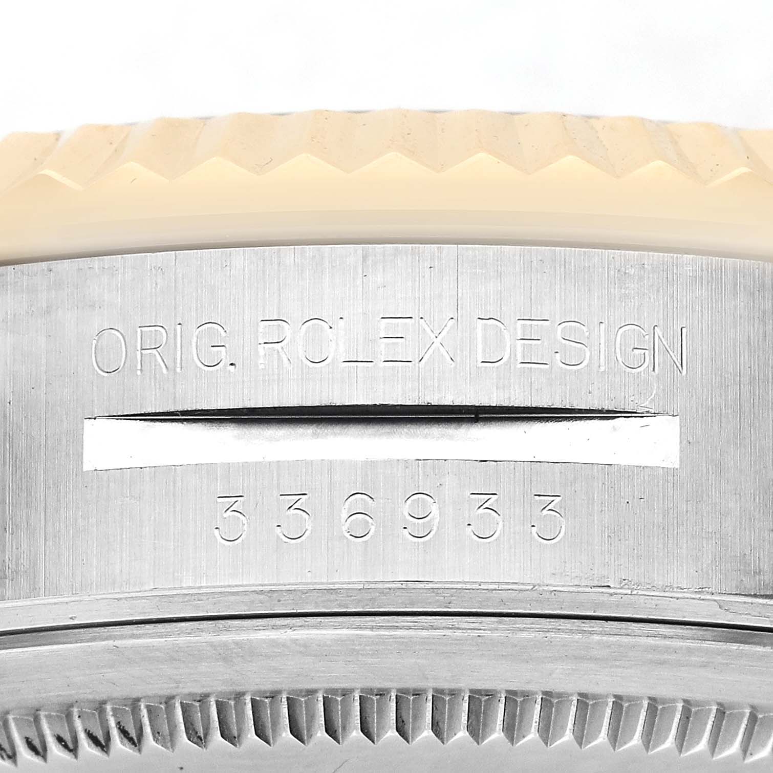 The image shows the engraved side of a Rolex Sky-Dweller 336933 Men's Steel and Gold (two tone) Silver Dial, highlighting the fluted bezel and model numbers.