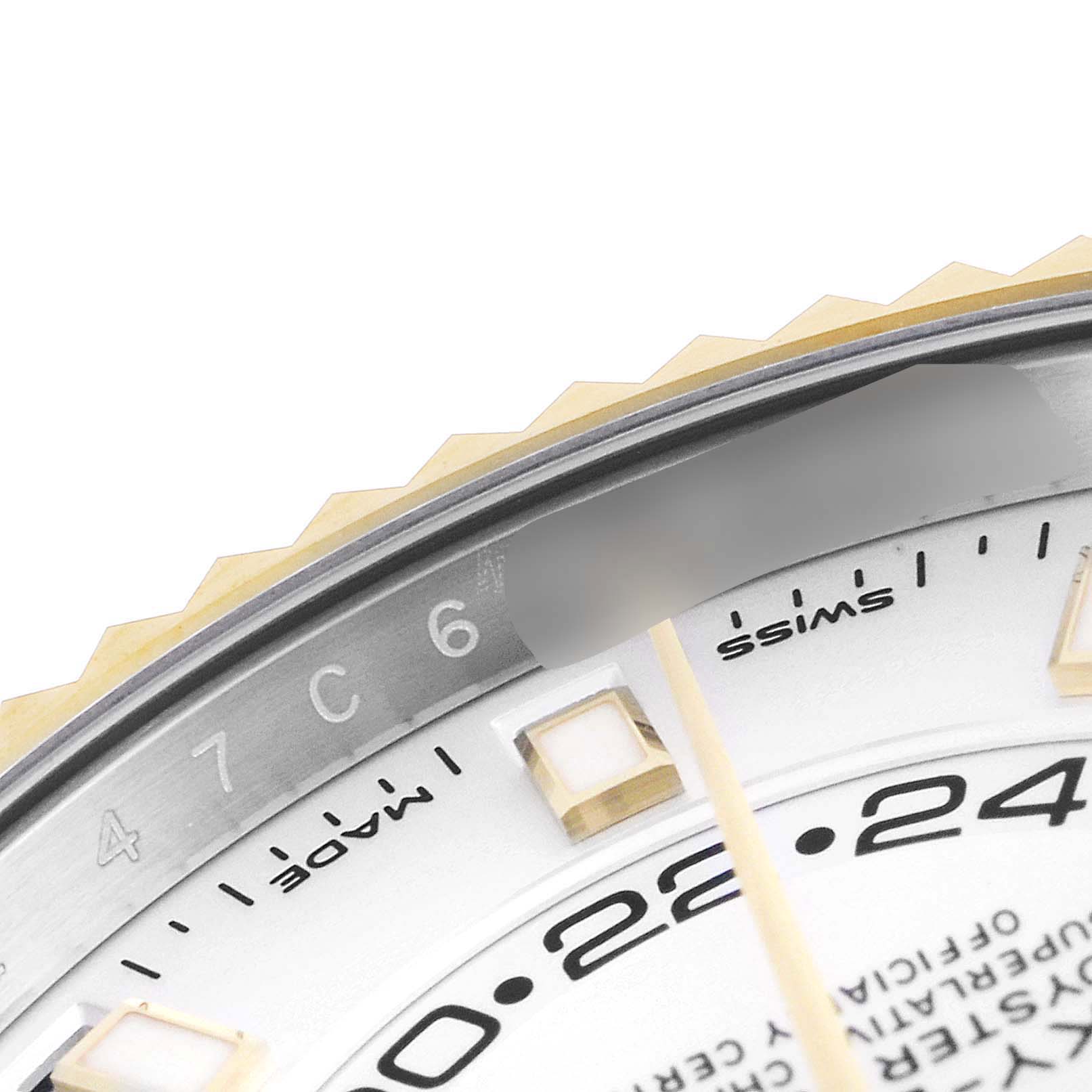 This close-up image of the Rolex Sky-Dweller 326933 Men's Steel and Gold (two tone) White Dial 326933 Men's Steel and Gold (two tone) White Dial watch shows the edge of the dial focusing on the hour markers and the circumference.