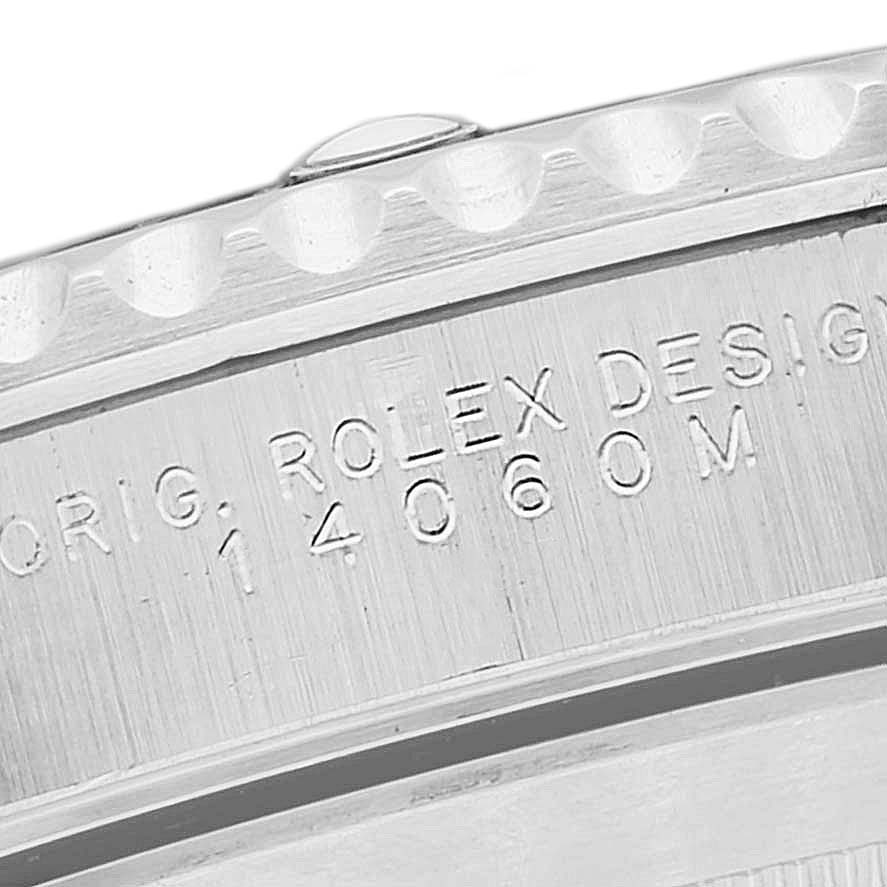 The image shows a close-up of the side of a Rolex Submariner 14060M Men's Stainless Steel Black Dial 14060M Men's Stainless Steel Black Dial watch, highlighting the engraved model number "14060M."