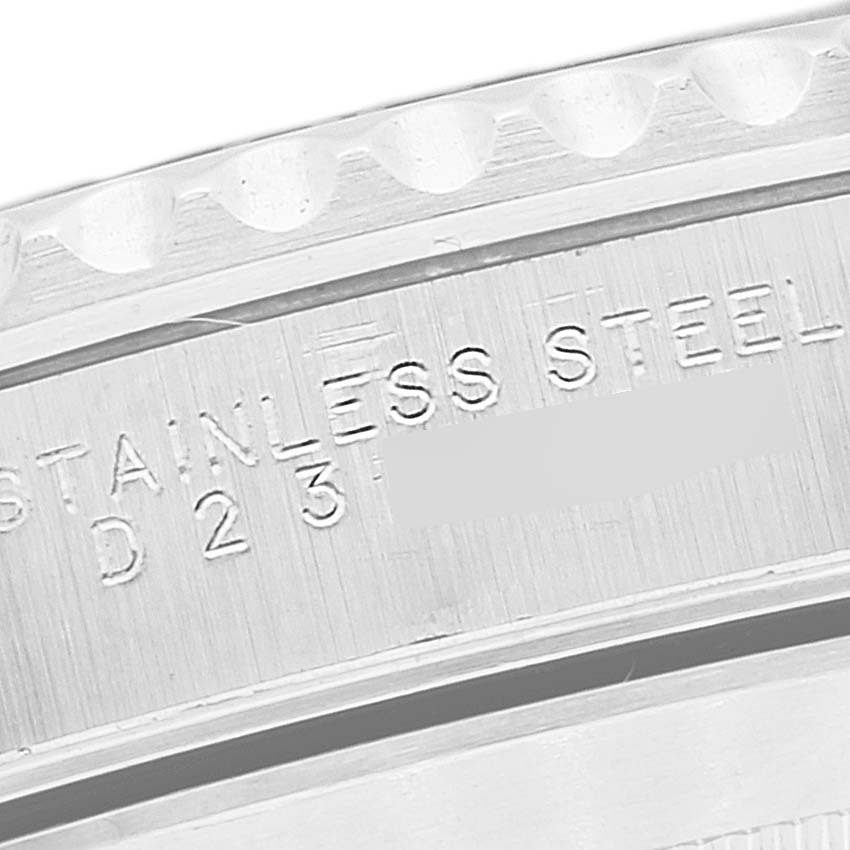 This image shows an engraved detail of the stainless steel casing of a Rolex Submariner 14060M Men's Stainless Steel Black Dial 14060M Men's Stainless Steel Black Dial watch.