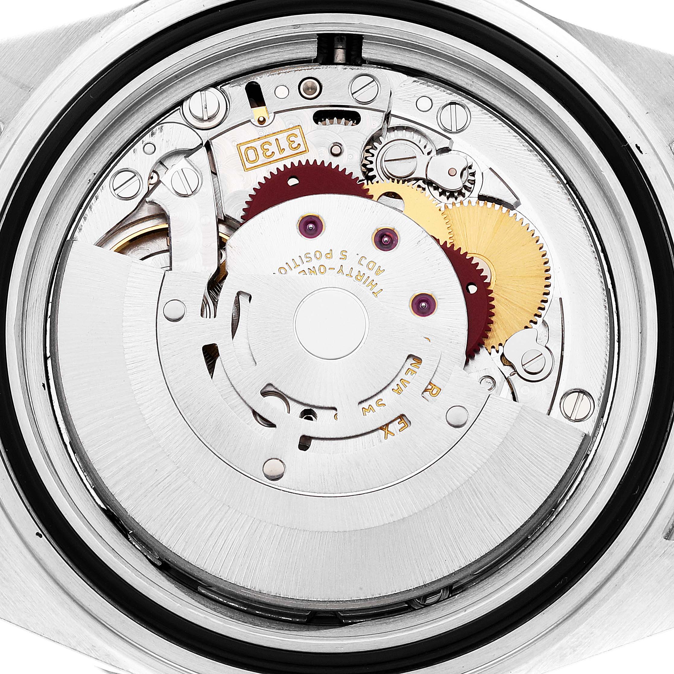 The image shows the intricate internal mechanics of the Rolex Submariner 14060M Men
s Stainless Steel Black Dial 14060M Men
s Stainless Steel Black Dial watch from a back view angle.