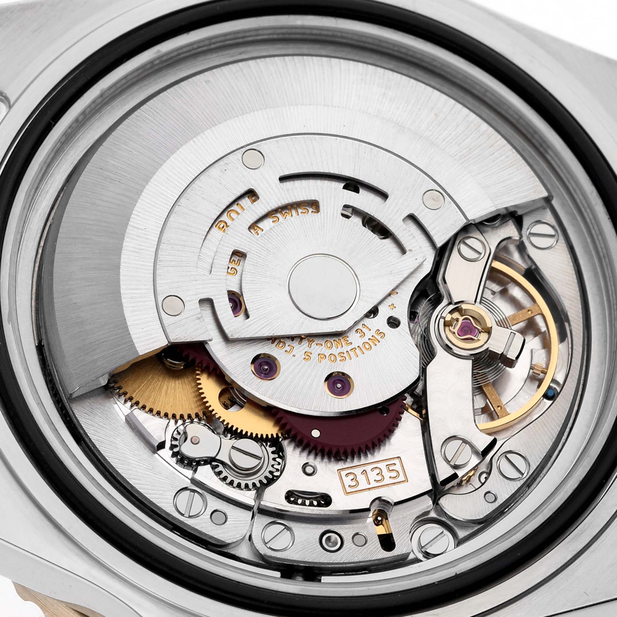 The image shows the movement mechanism of a Rolex Submariner 16613LB Men's Steel and Gold (two tone) Blue Dial 16613LB Men's Steel and Gold (two tone) Blue Dial watch from a back view, highlighting gears and the rotor.
