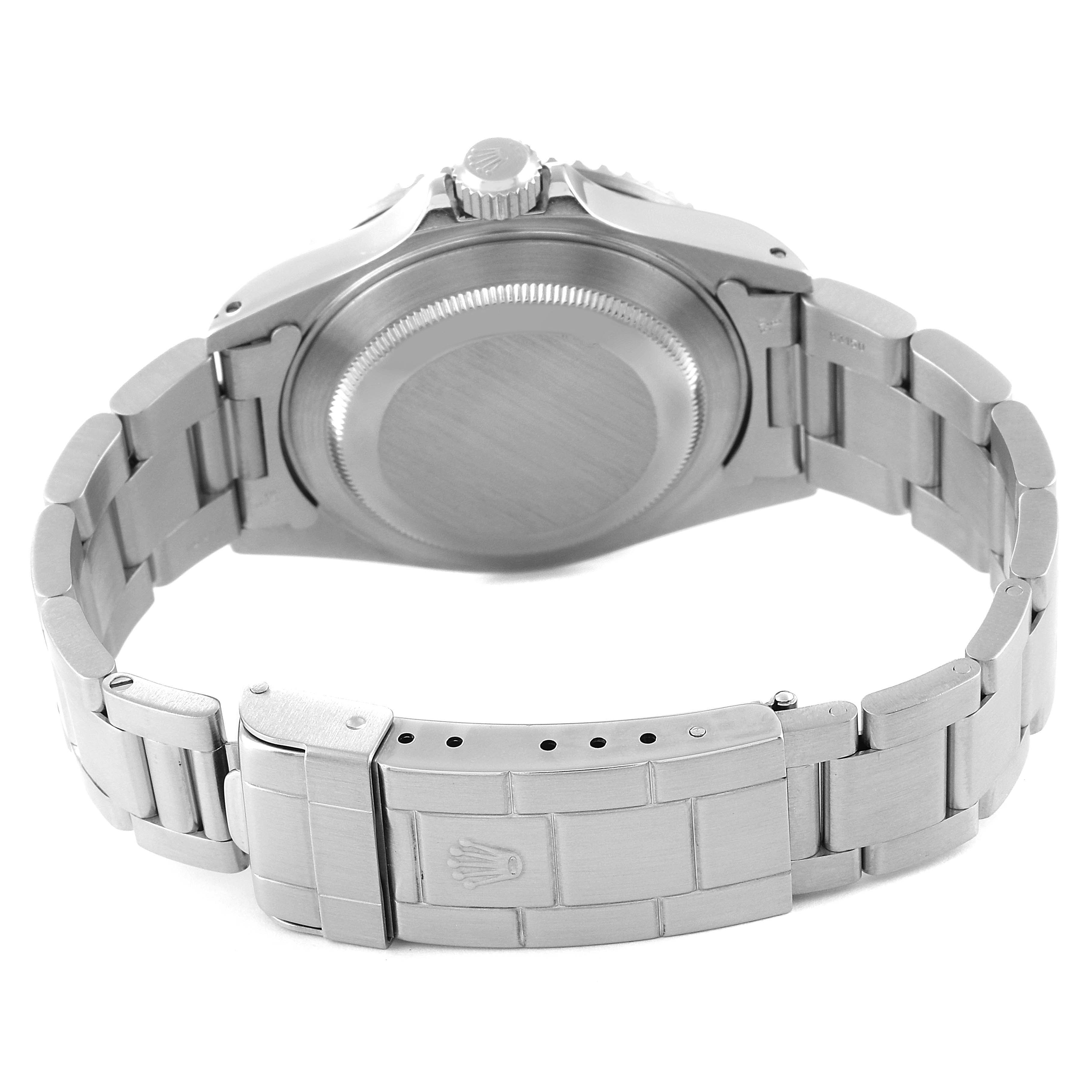 The image shows the rear view of a Rolex Submariner 16610 Men's Stainless Steel Black Dial 16610 Men's Stainless Steel Black Dial watch, highlighting the case back and bracelet with the clasp.