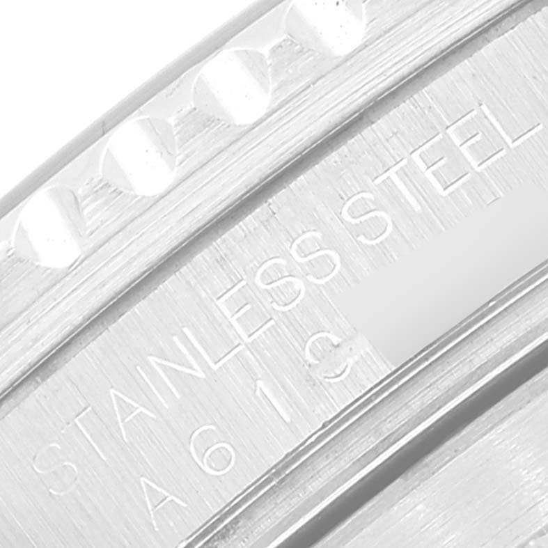 The image shows a close-up of the engraved serial number and "STAINLESS STEEL" marking on the bezel of a Rolex Submariner 16610 Men's Stainless Steel Black Dial 16610 Men's Stainless Steel Black Dial watch.