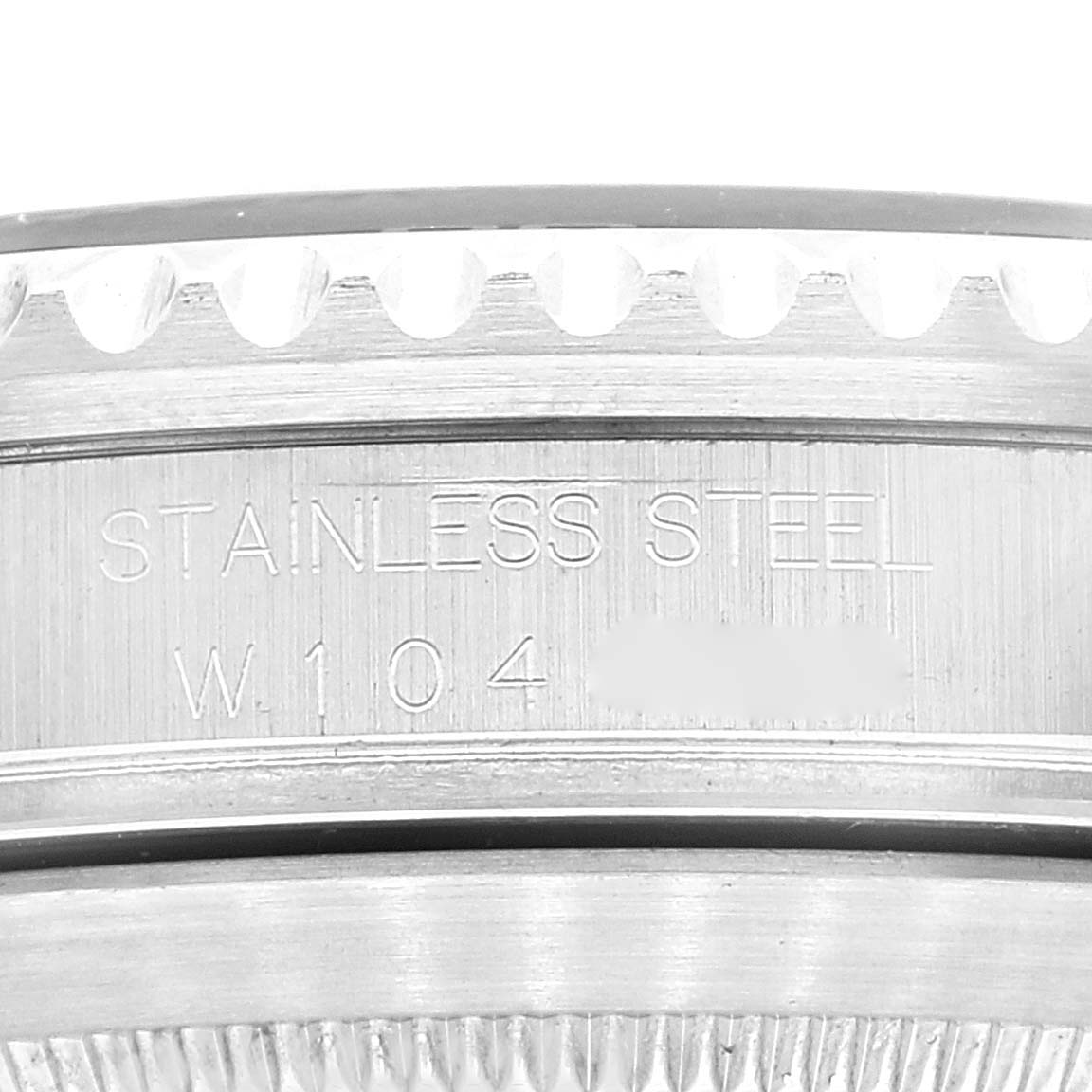 The image shows a close-up of the engraved stainless steel case back of a Rolex Submariner 16610 Men
s Stainless Steel Black Dial 16610 Men
s Stainless Steel Black Dial watch.