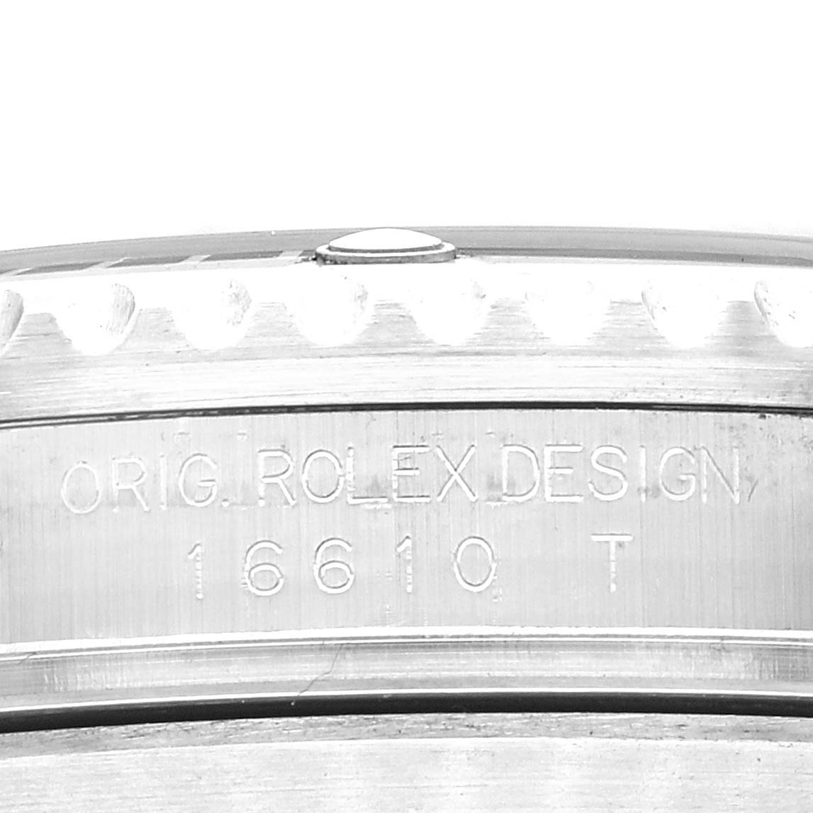 Close-up view of the side of the bezel and case back engraving on a Rolex Submariner 16610LV Men's Stainless Steel Black Dial 16610LV Men's Stainless Steel Black Dial model 16610.