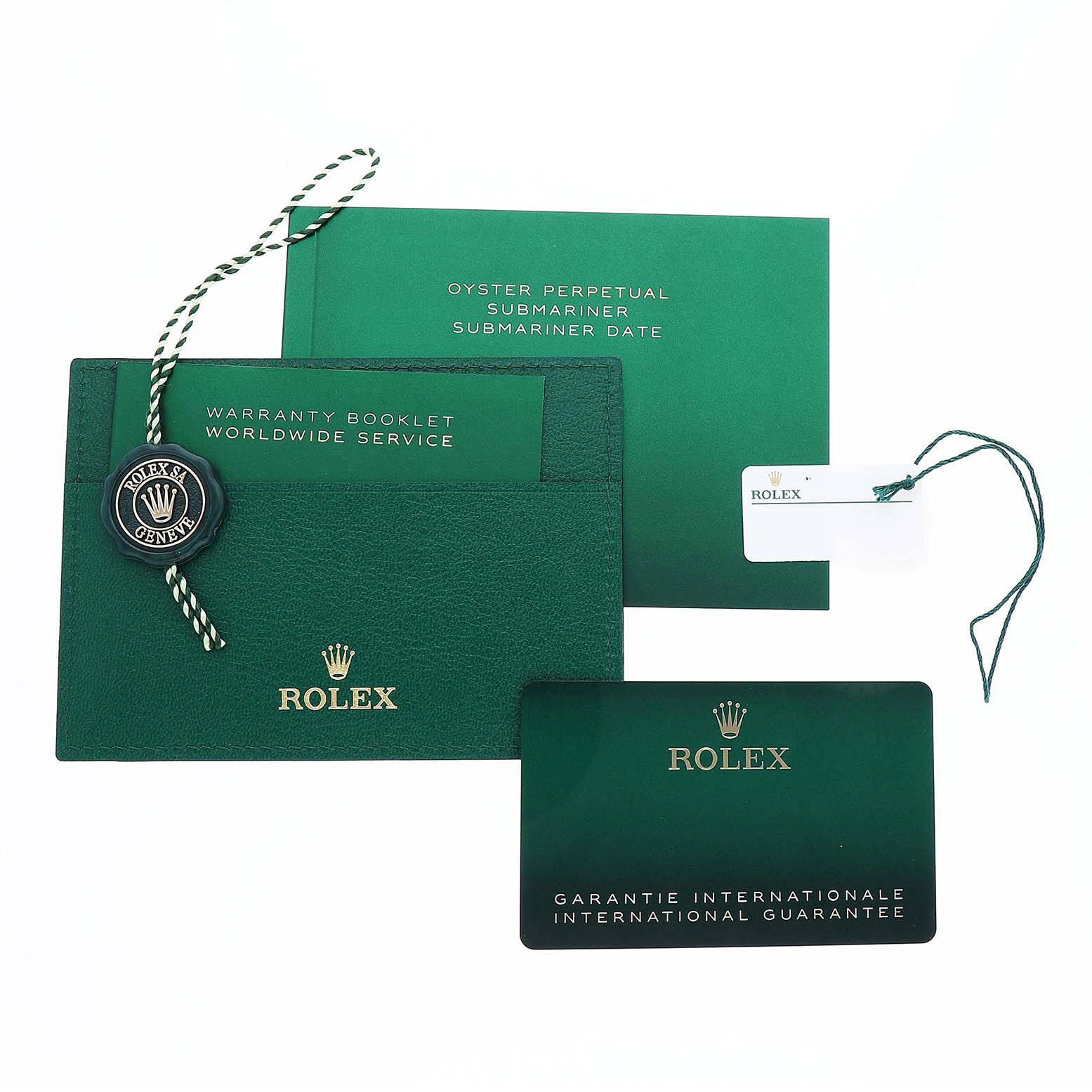 The image shows Rolex Submariner 126610LV Men's Stainless Steel Black Dial accessories including a green warranty booklet, guarantee card, and a branded tag.