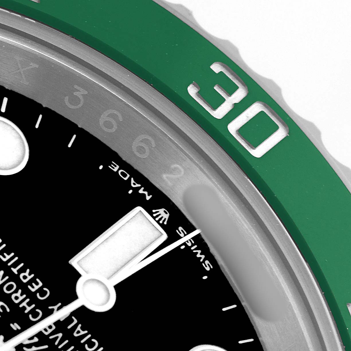 The image shows a close-up of the Rolex Submariner 126610LV Men's Stainless Steel Black Dial's bezel, dial edge, and minute hand at an angle highlighting the "30" on the green bezel.