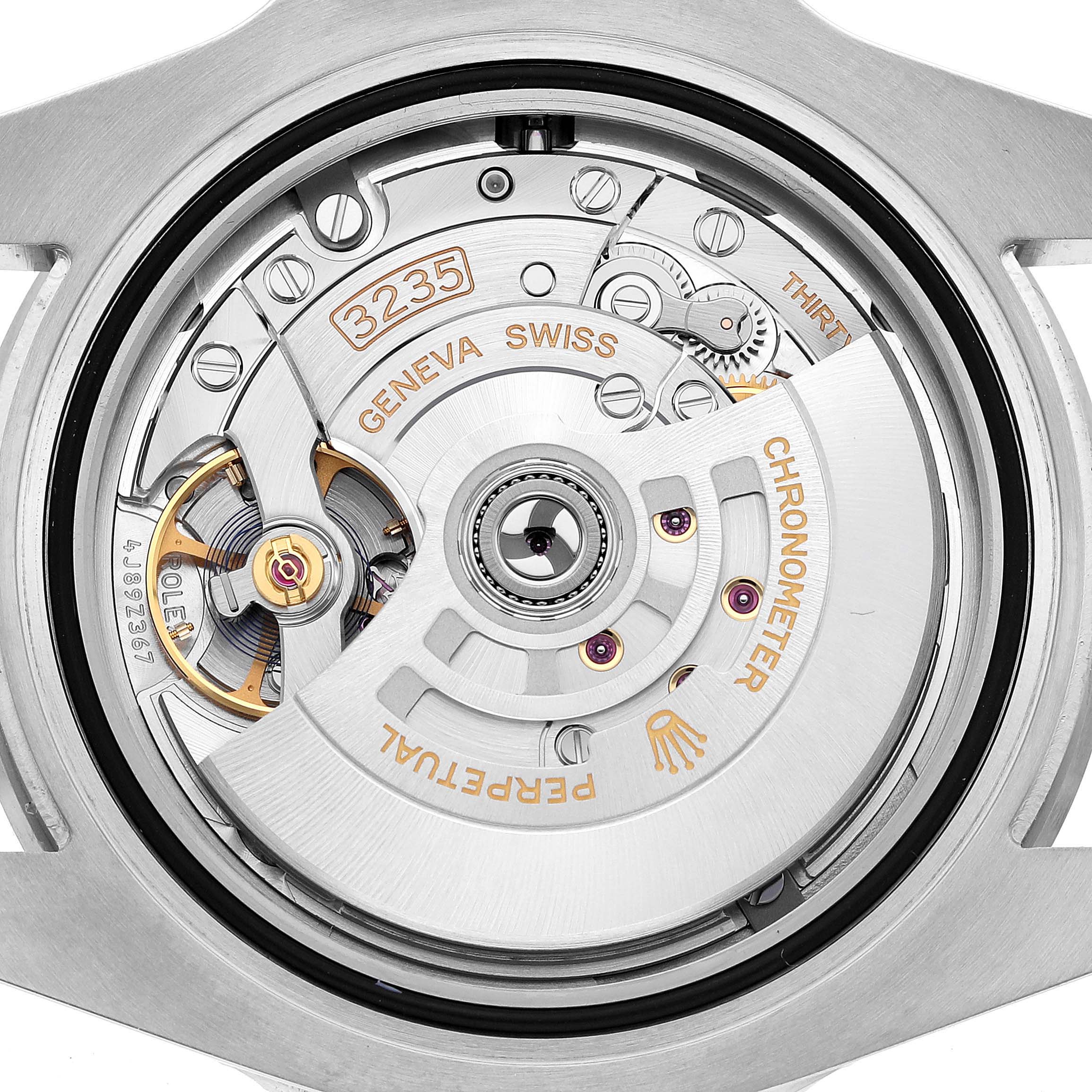 The image shows a close-up of the Rolex Submariner 126610LV Men's Stainless Steel Black Dial's movement, highlighting the intricate mechanics and "3235" marking.