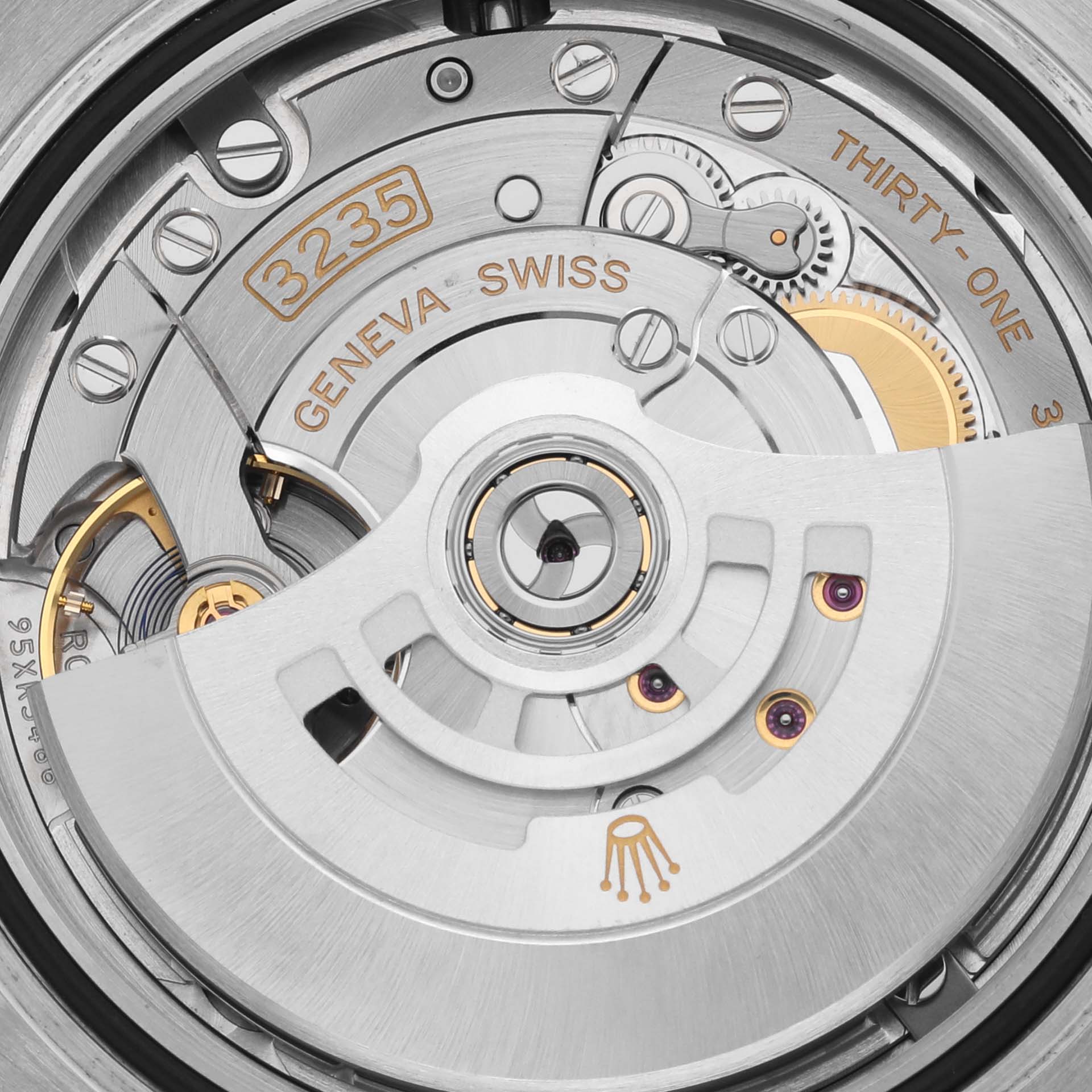 The image shows the movement mechanism of a Rolex Submariner 126610LV Men's Stainless Steel Black Dial 126610LV Men's Stainless Steel Black Dial watch, highlighting gears and the rotor from a close-up angle.