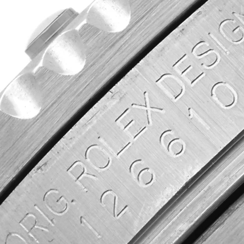 The image shows a close-up of the edge of the Rolex Submariner 126610LV Men's Stainless Steel Black Dial 126610LV Men's Stainless Steel Black Dial bezel with the engraved model number visible.