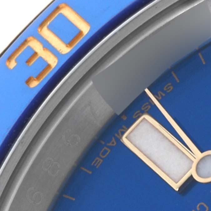 The image shows a close-up view of the dial, hands, and bezel of the Rolex Submariner 116613LB Men's Steel and Gold (two tone) Blue Dial 116613LB Men's Steel and Gold (two tone) Blue Dial.