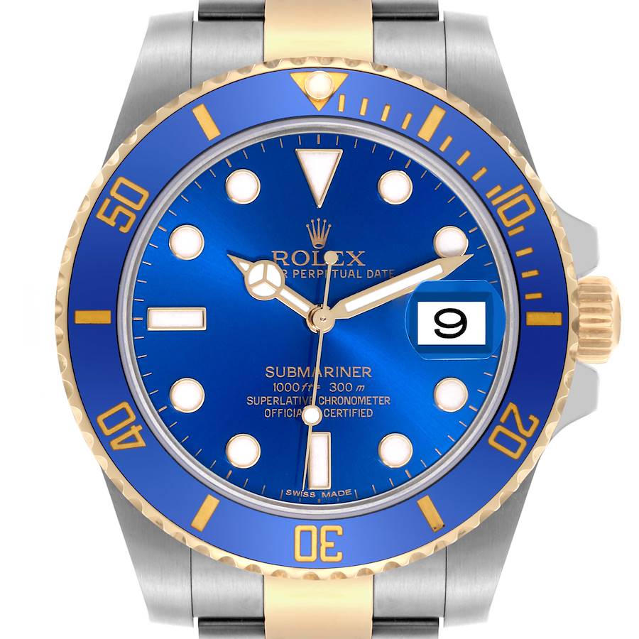 The Rolex Submariner is shown from a frontal angle, displaying the blue dial, bezel, indices, and part of the bracelet.