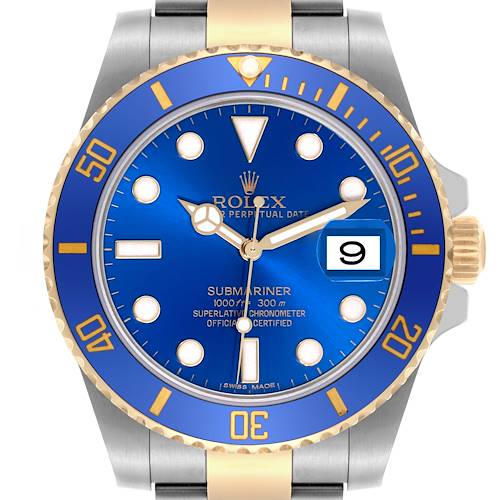 The Rolex Submariner is shown in a front-facing angle, highlighting its blue dial, gold and silver bracelet, and the date window.