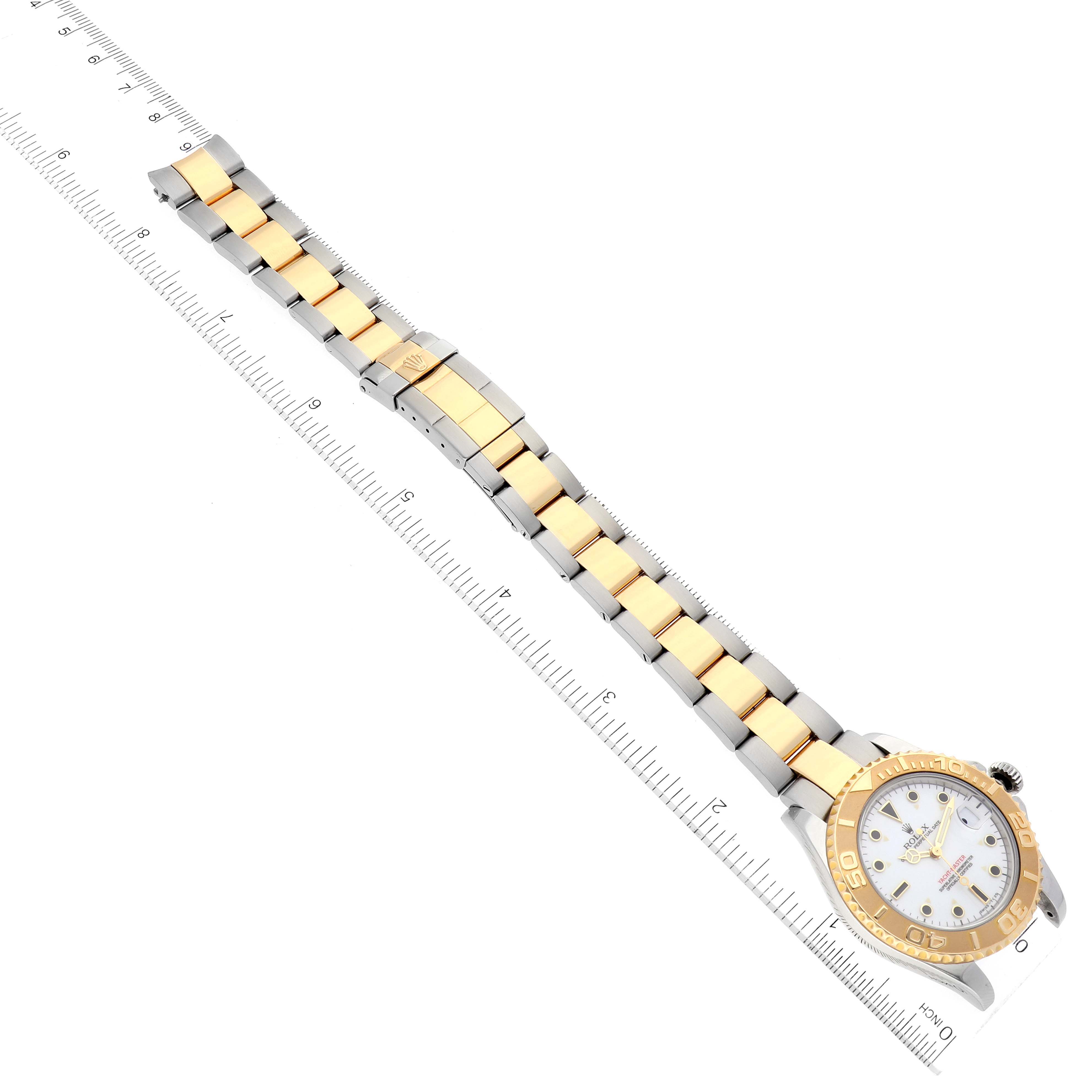 This image shows a top view of a Rolex Yacht-Master 68623 Men's Steel and Gold (two tone) White Dial 68623 Men's Steel and Gold (two tone) White Dial watch, displaying the full bracelet and dial alongside a measuring ruler.