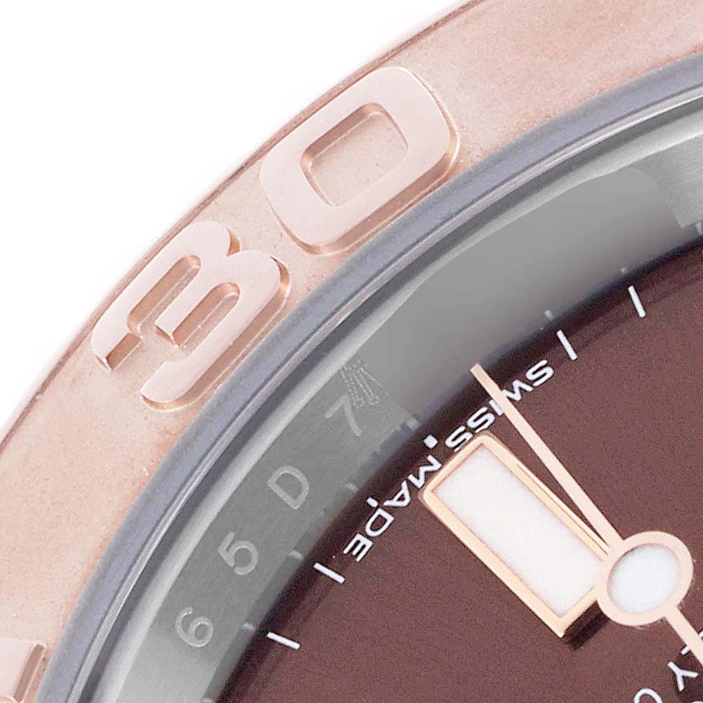 The image shows a close-up of the Rolex Yacht-Master 116621 Men's Steel and Gold (two tone) Brown Dial 116621 Men's Steel and Gold (two tone) Brown Dial's bezel and dial, highlighting the outer numbers and a portion of the hands.