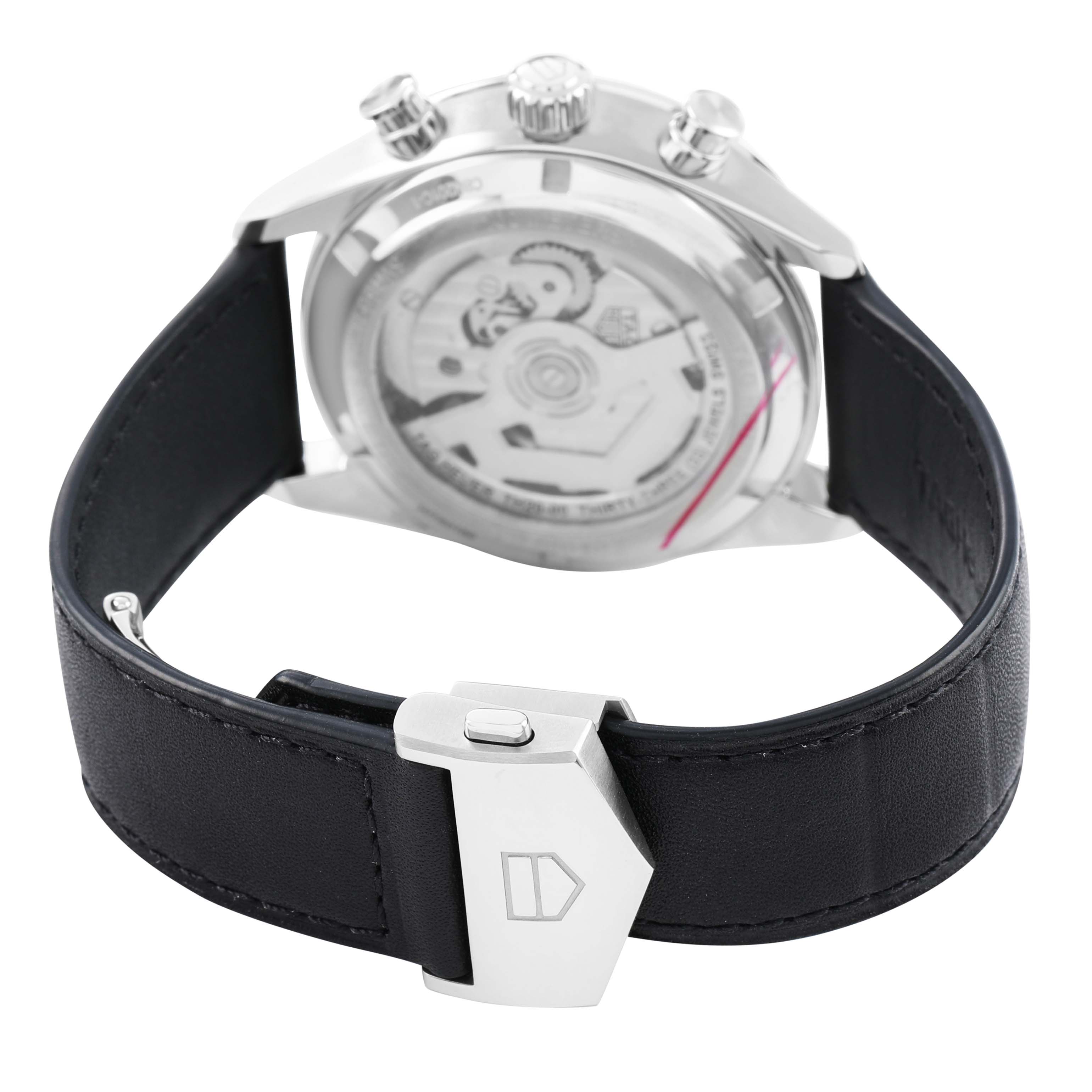 The image shows the back of a Tag Heuer Carrera CBN201C.FC6542 Men's Stainless Steel Black Dial watch, highlighting the movement and clasp on the strap.